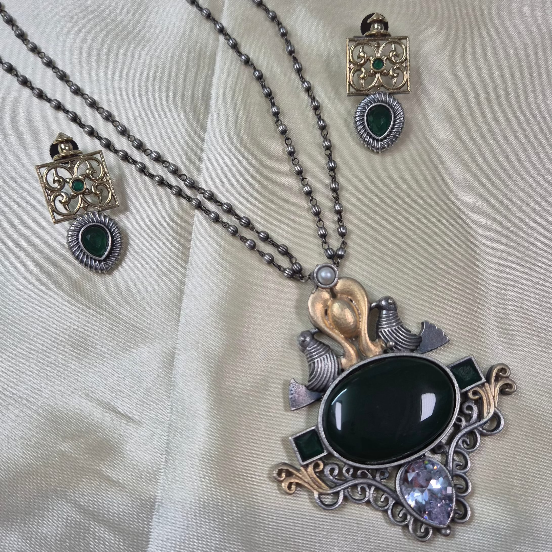 Oxidised mid length set with deep green monalisa stones