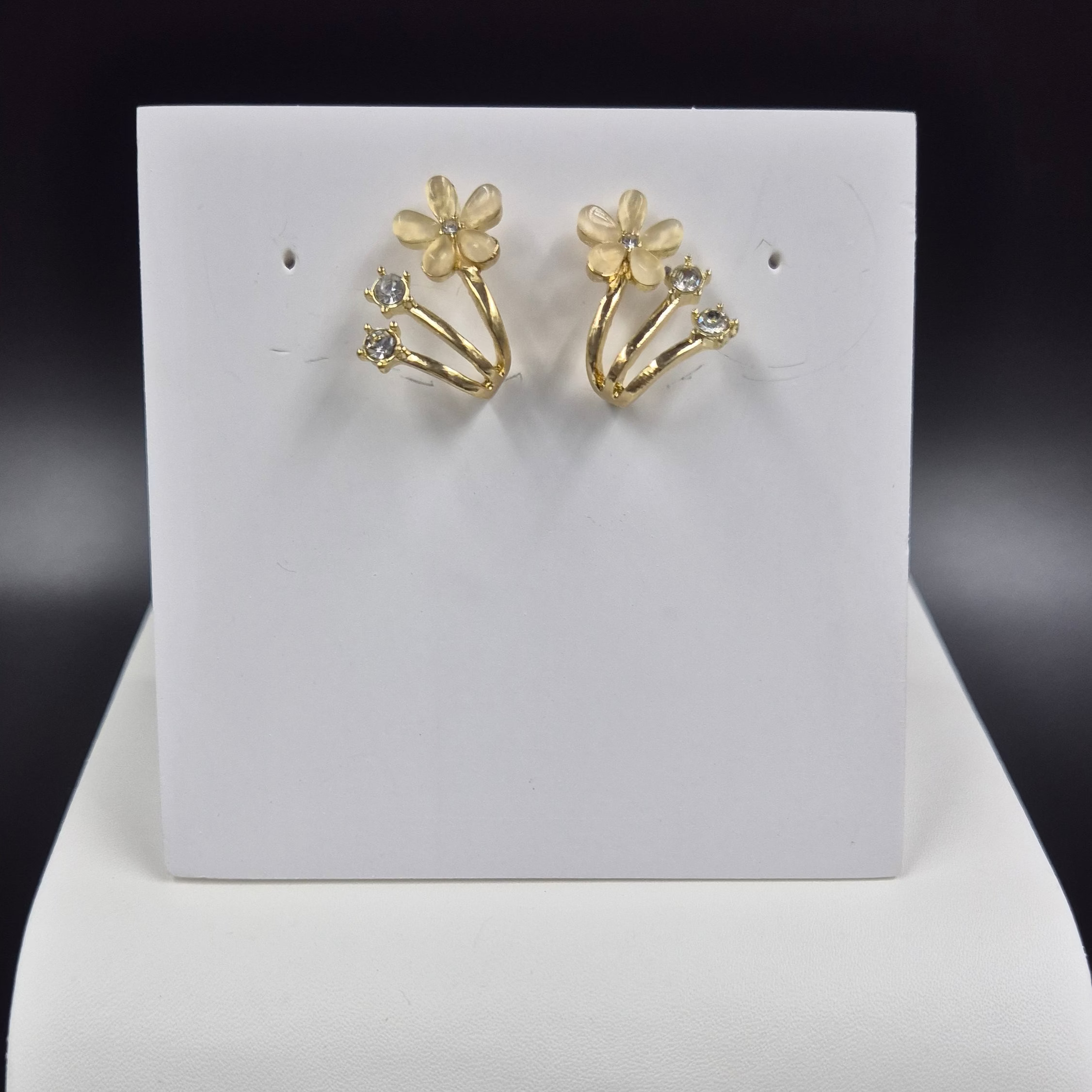 White cat's eye stoned flower stud