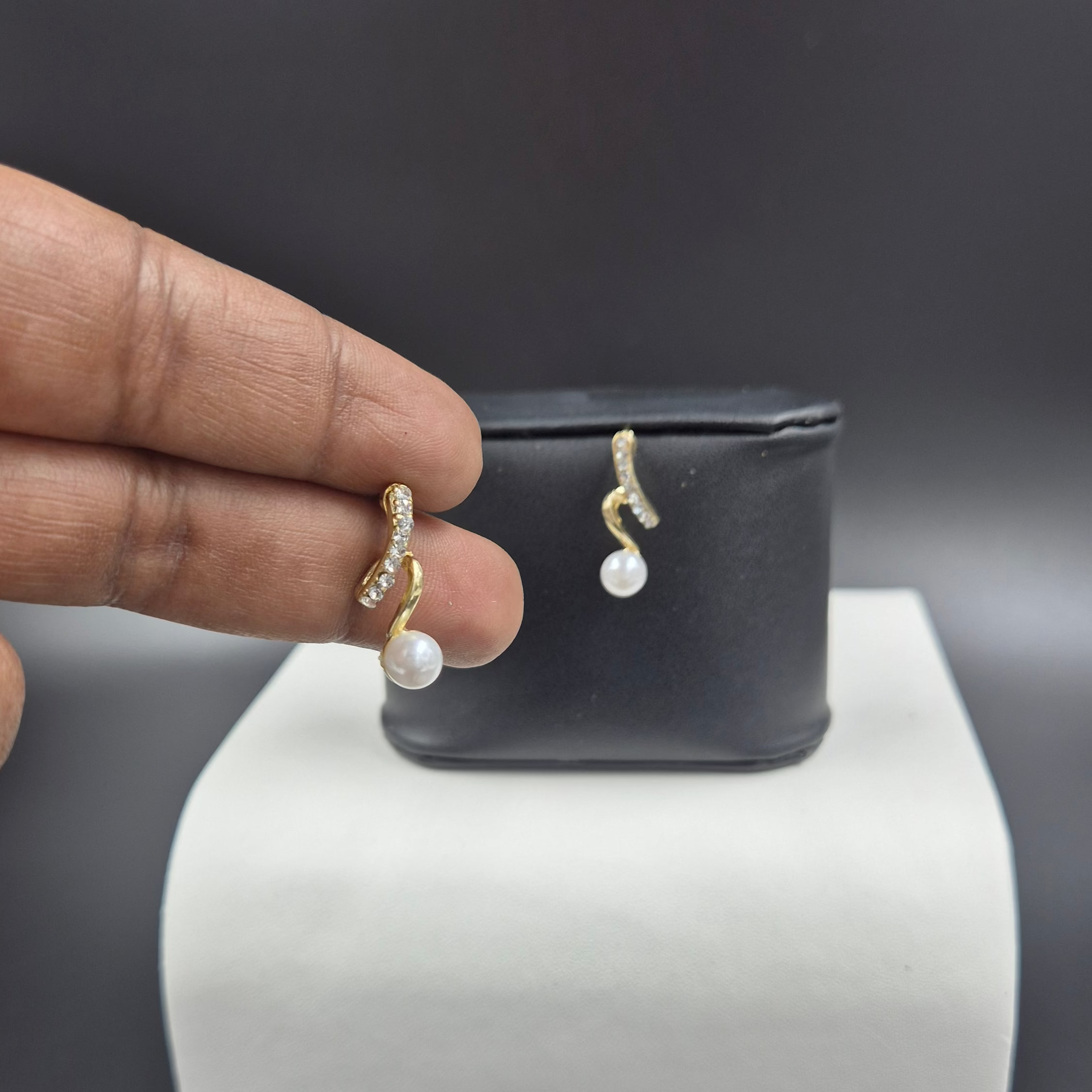 White pearl drop stud with stone embossed in the top stud
