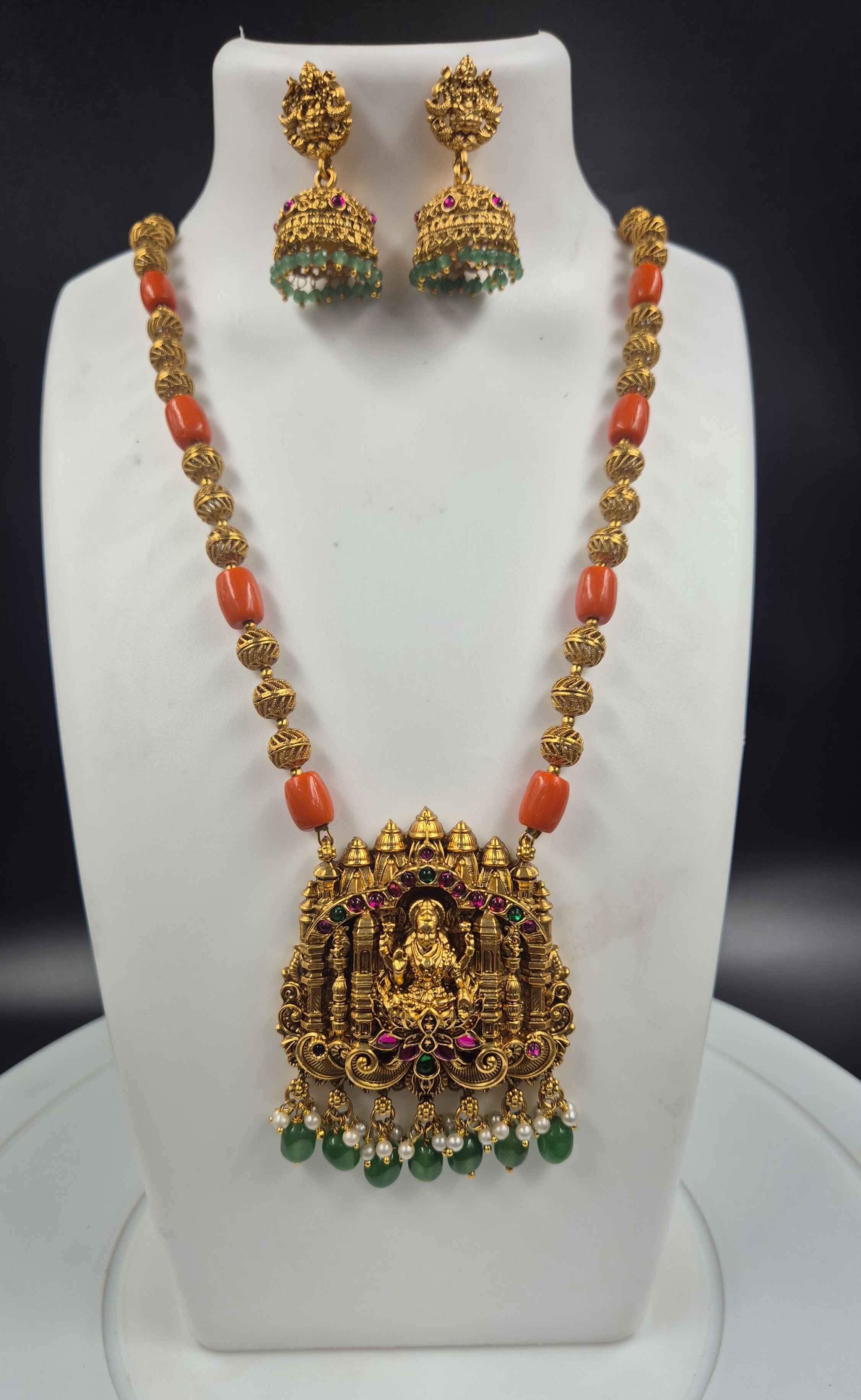 Antique Gold Finish Lakshmi Temple Pendant Necklace Set with Coral Beads & Jhumka Earrings