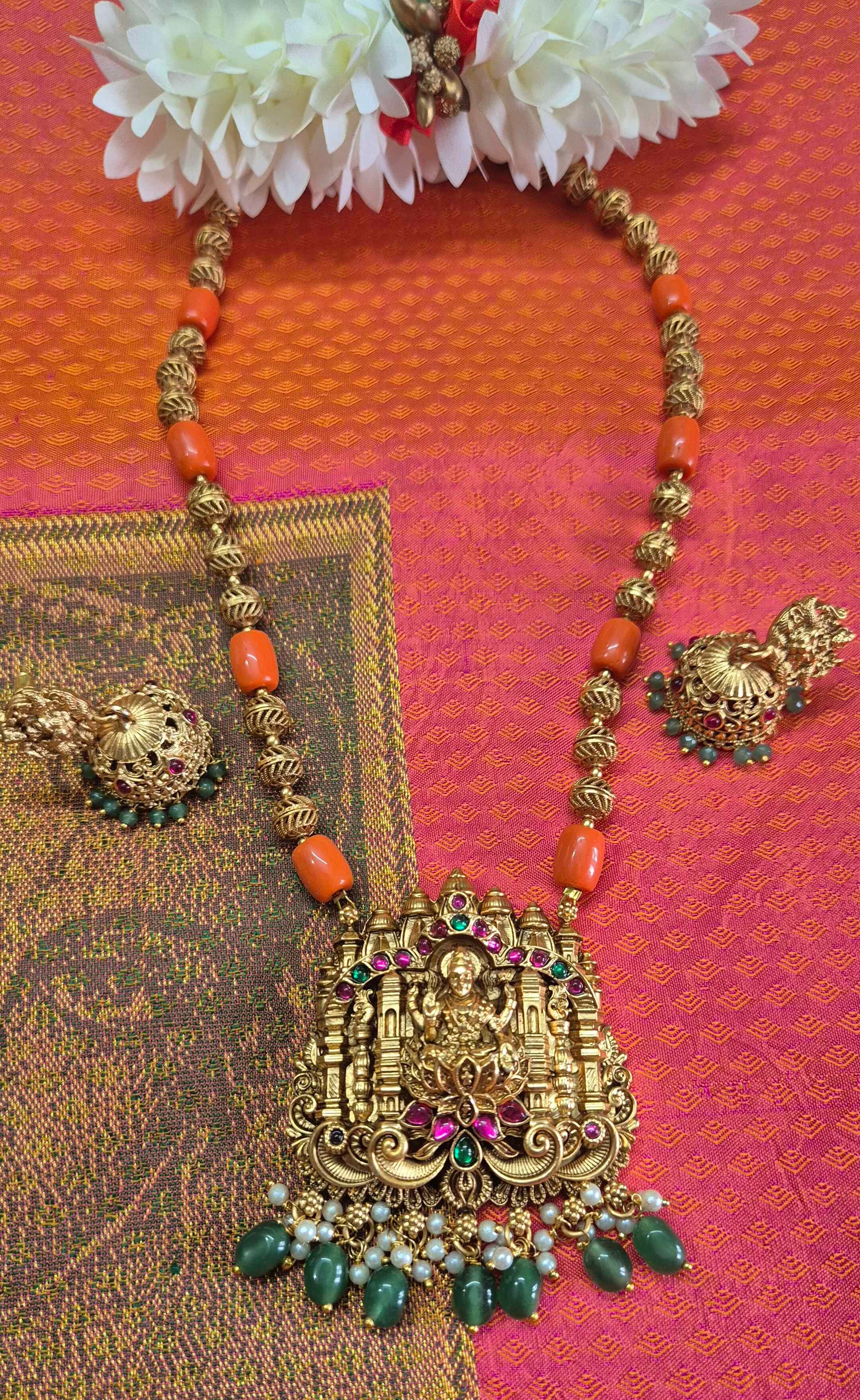 Antique Gold Finish Lakshmi Temple Pendant Necklace Set with Coral Beads & Jhumka Earrings
