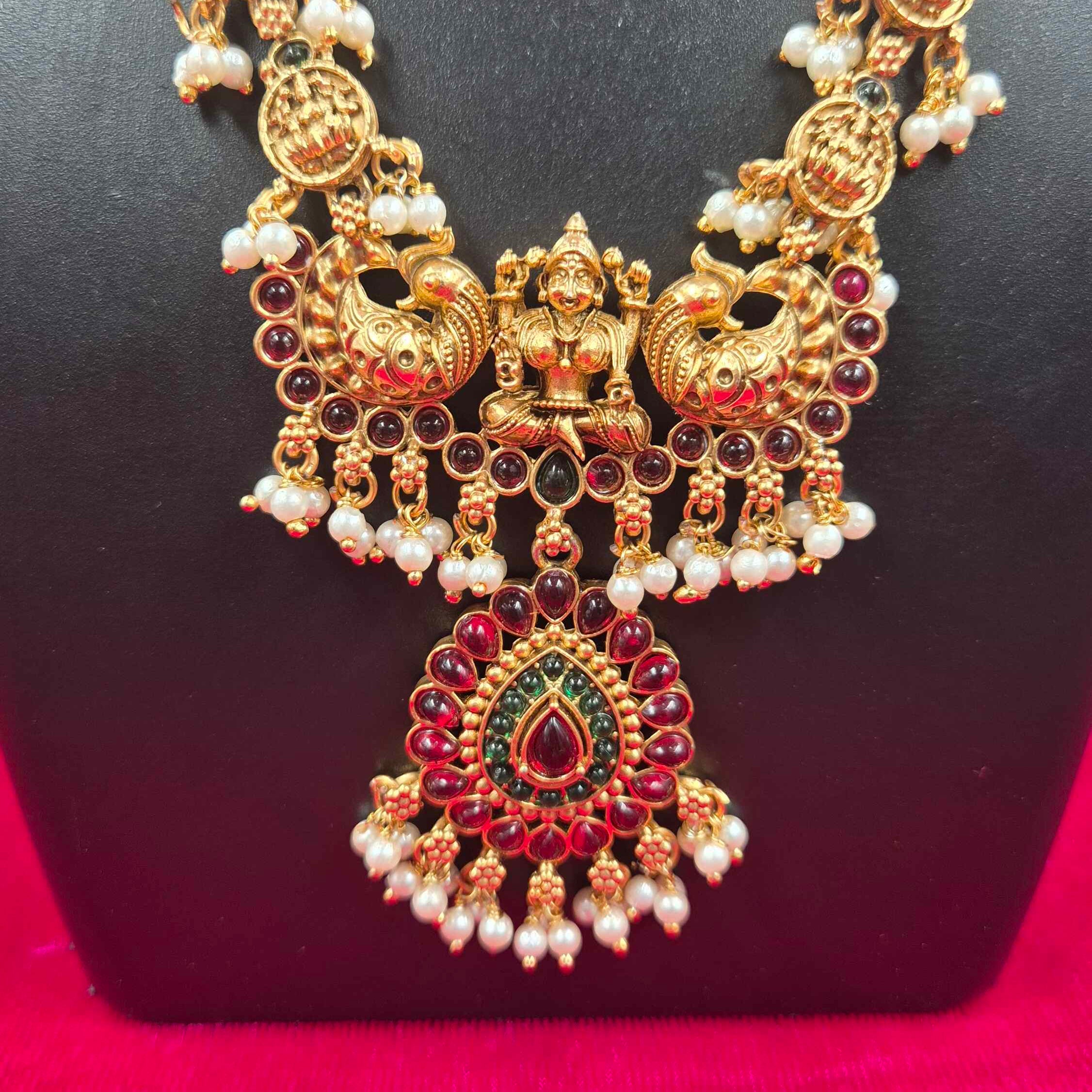 Antique Gold Finish Lakshmi Coin Haram Necklace Set with Ruby Stone Pendant & Pearl Drops