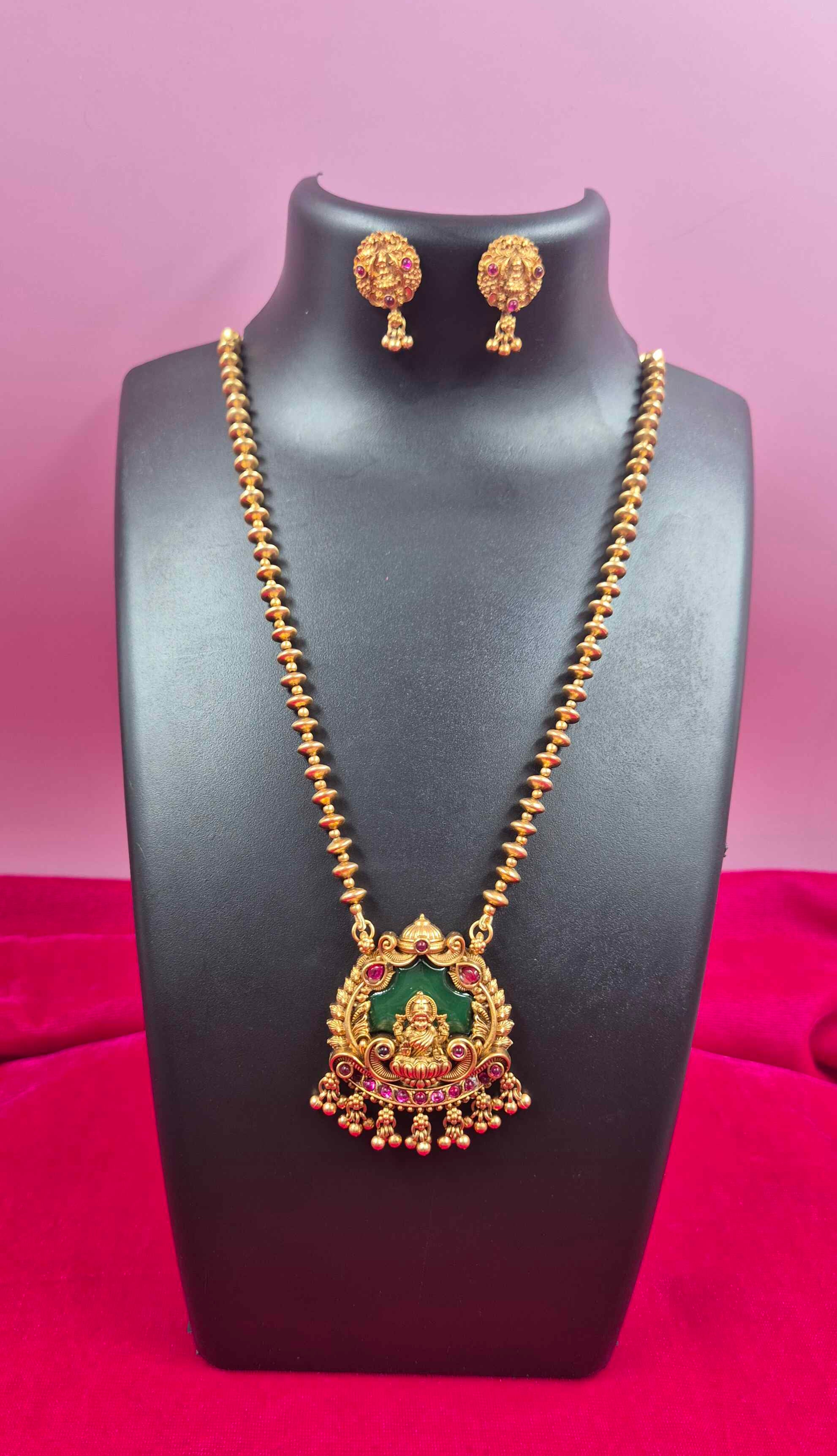 Antique Gold palaikka  Finish Lakshmi Pendant Necklace Set with Green Enamel & Ruby Stone Accents