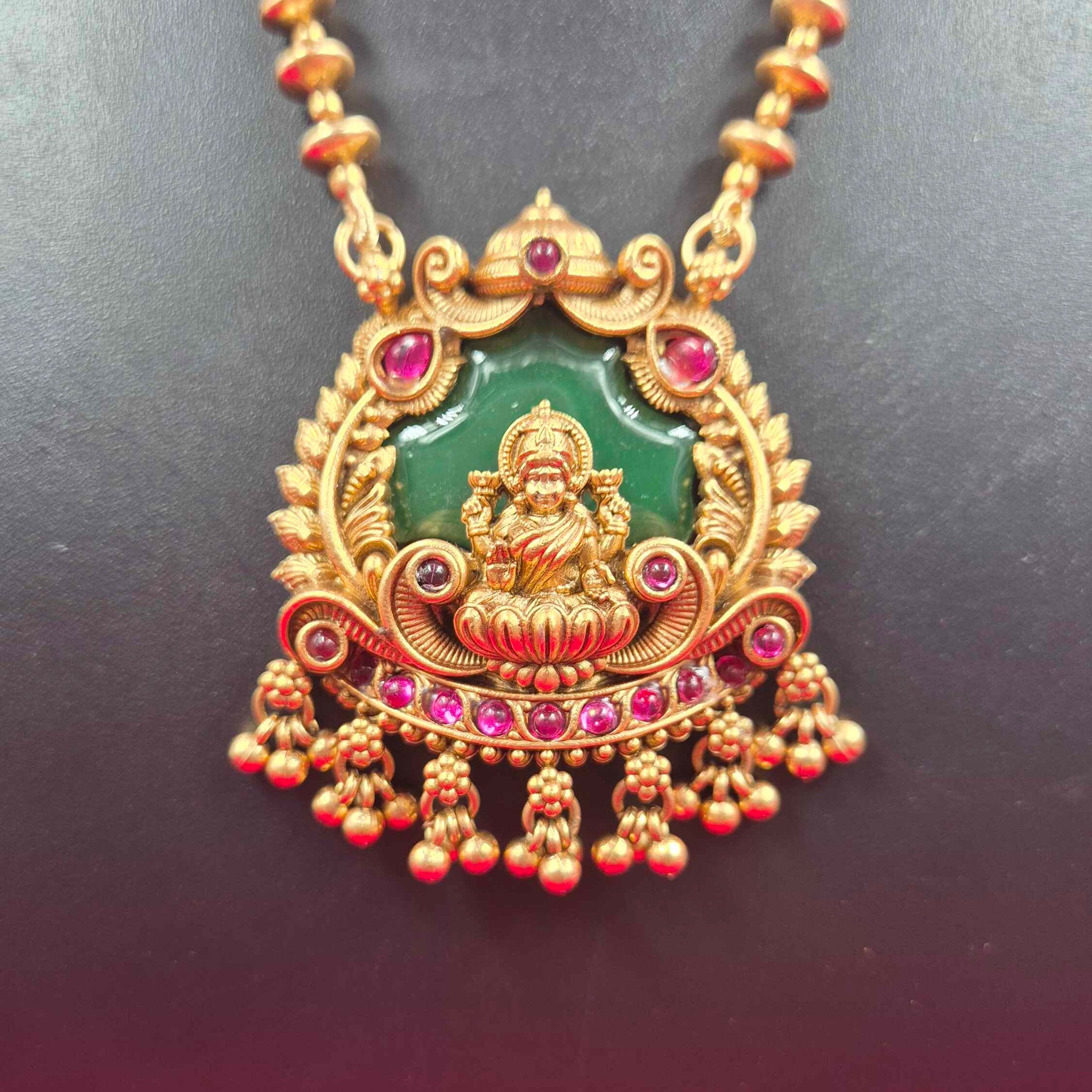 Antique Gold palaikka  Finish Lakshmi Pendant Necklace Set with Green Enamel & Ruby Stone Accents