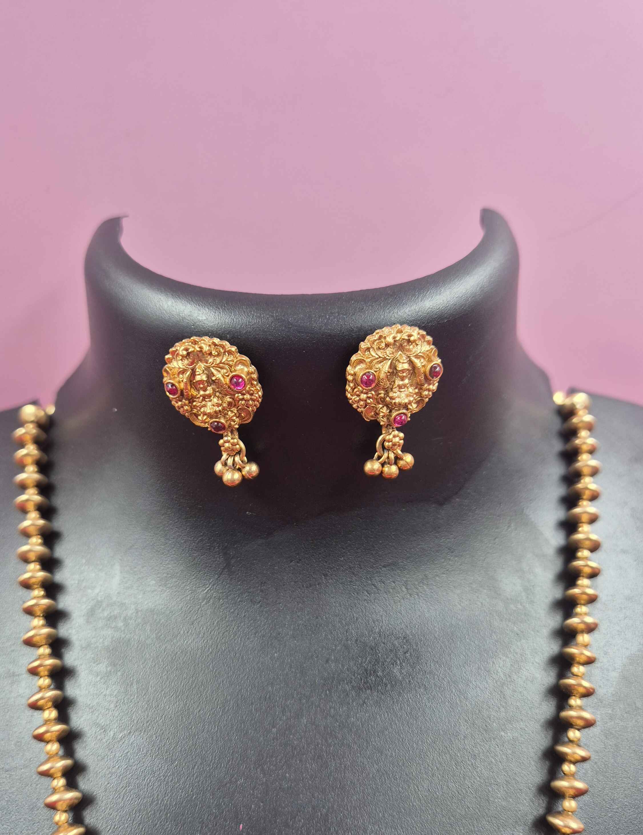 Antique Gold palaikka  Finish Lakshmi Pendant Necklace Set with Green Enamel & Ruby Stone Accents