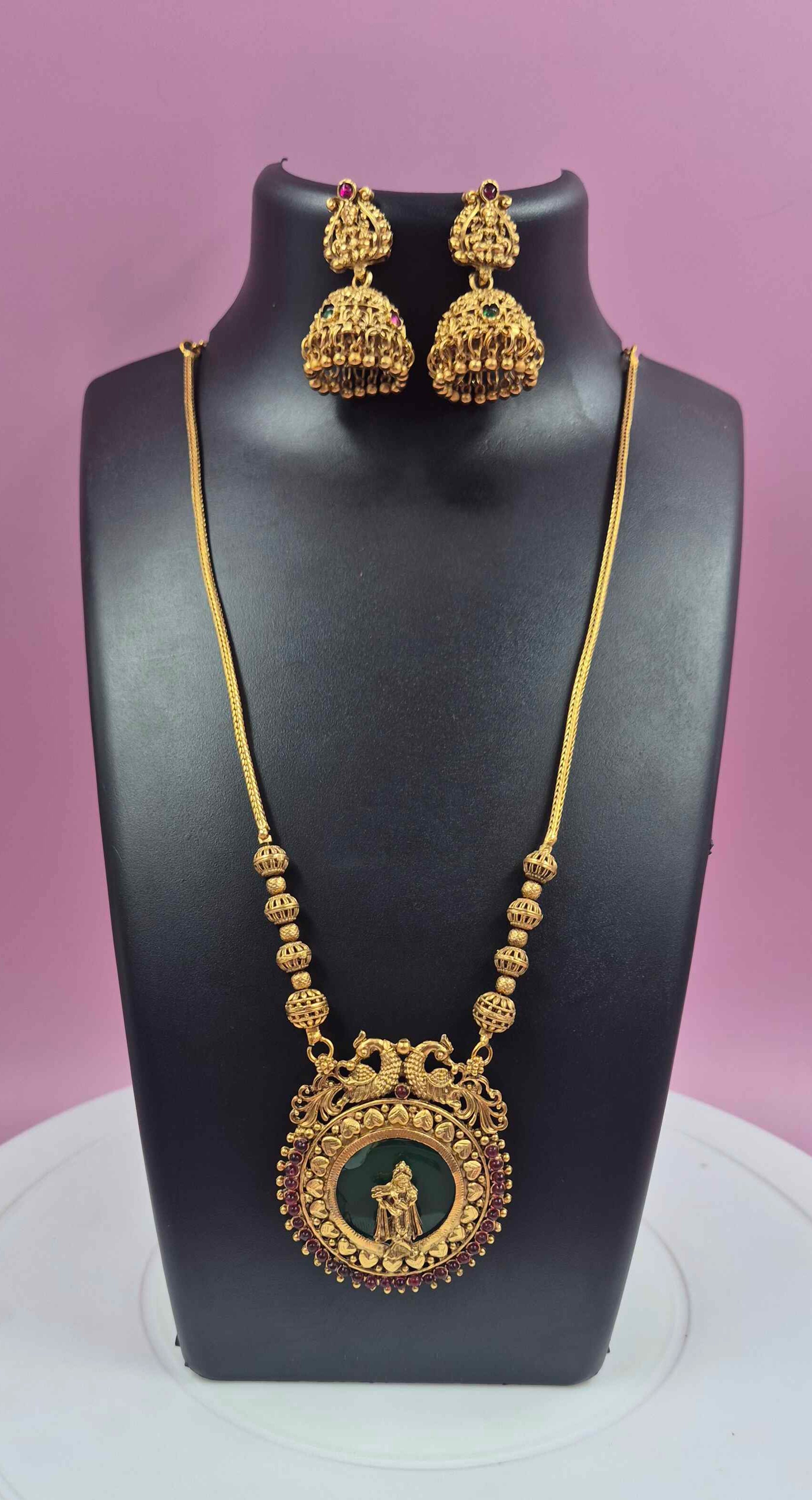 Antique Gold Finish Palaikka Krishna Pendant Necklace Set with Green Enamel & Ruby Stone Accents