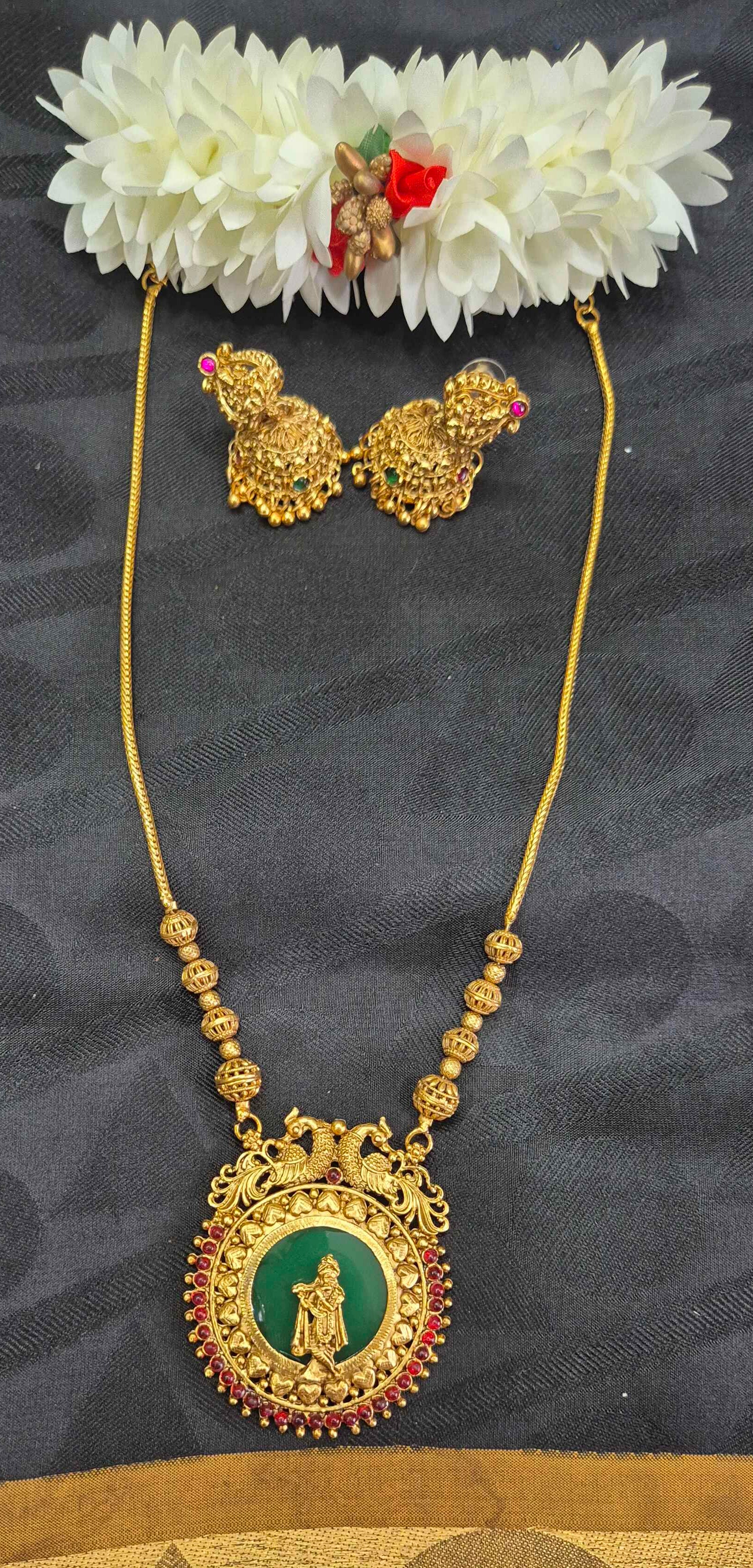 Antique Gold Finish Palaikka Krishna Pendant Necklace Set with Green Enamel & Ruby Stone Accents