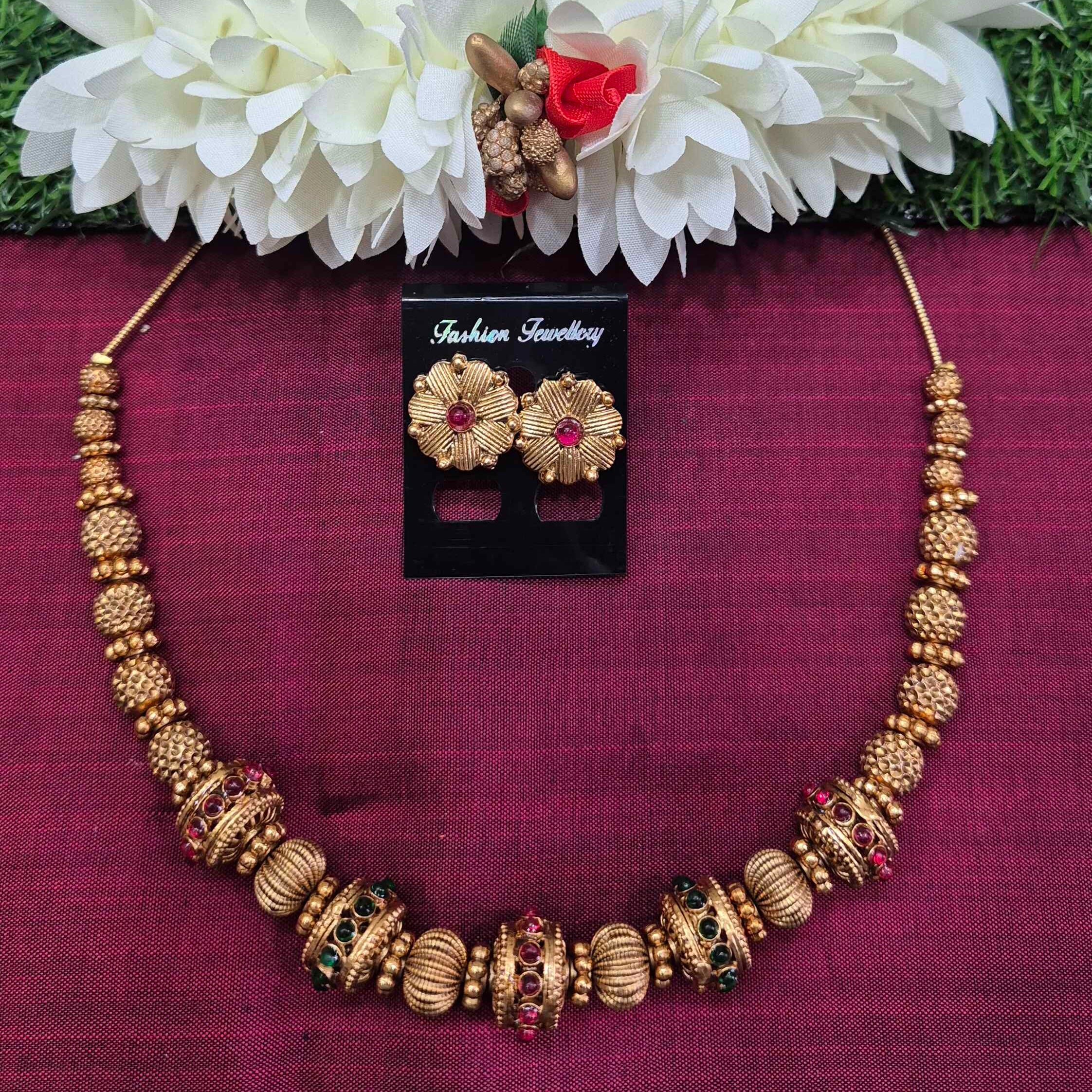 Gold Designer ball Necklace Set with Ruby & Emerald Stone Accents