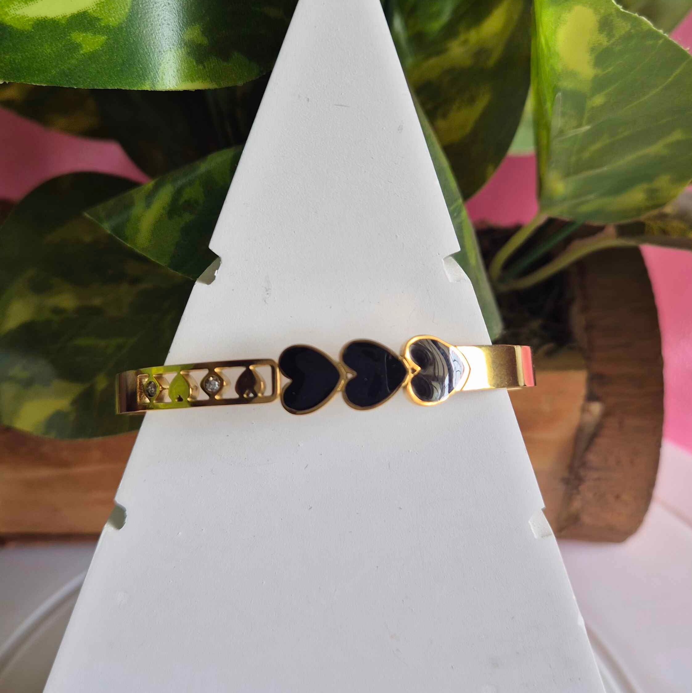 Gold-Tone Heart Motif Kada Bracelet with Black Enamel Accents