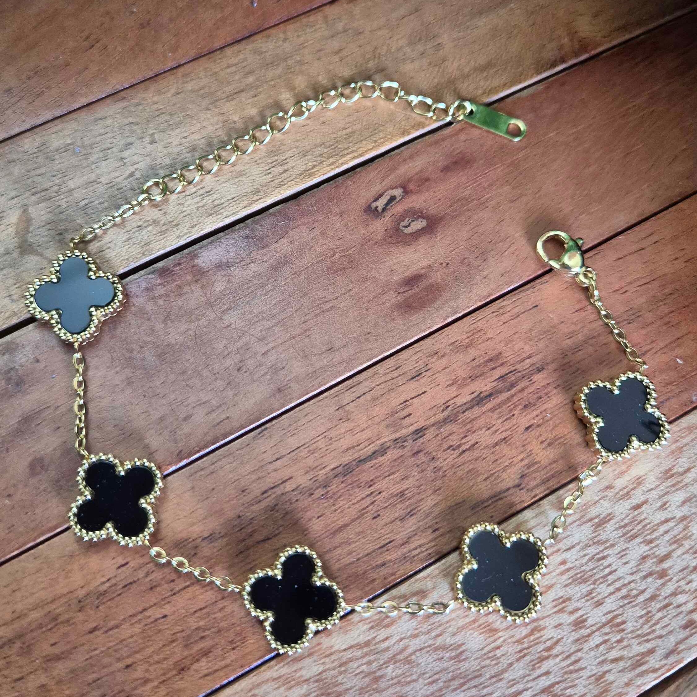 Black Clover Charm Bracelet for Women | Gold-Tone Floral Motif Adjustable Bracelet