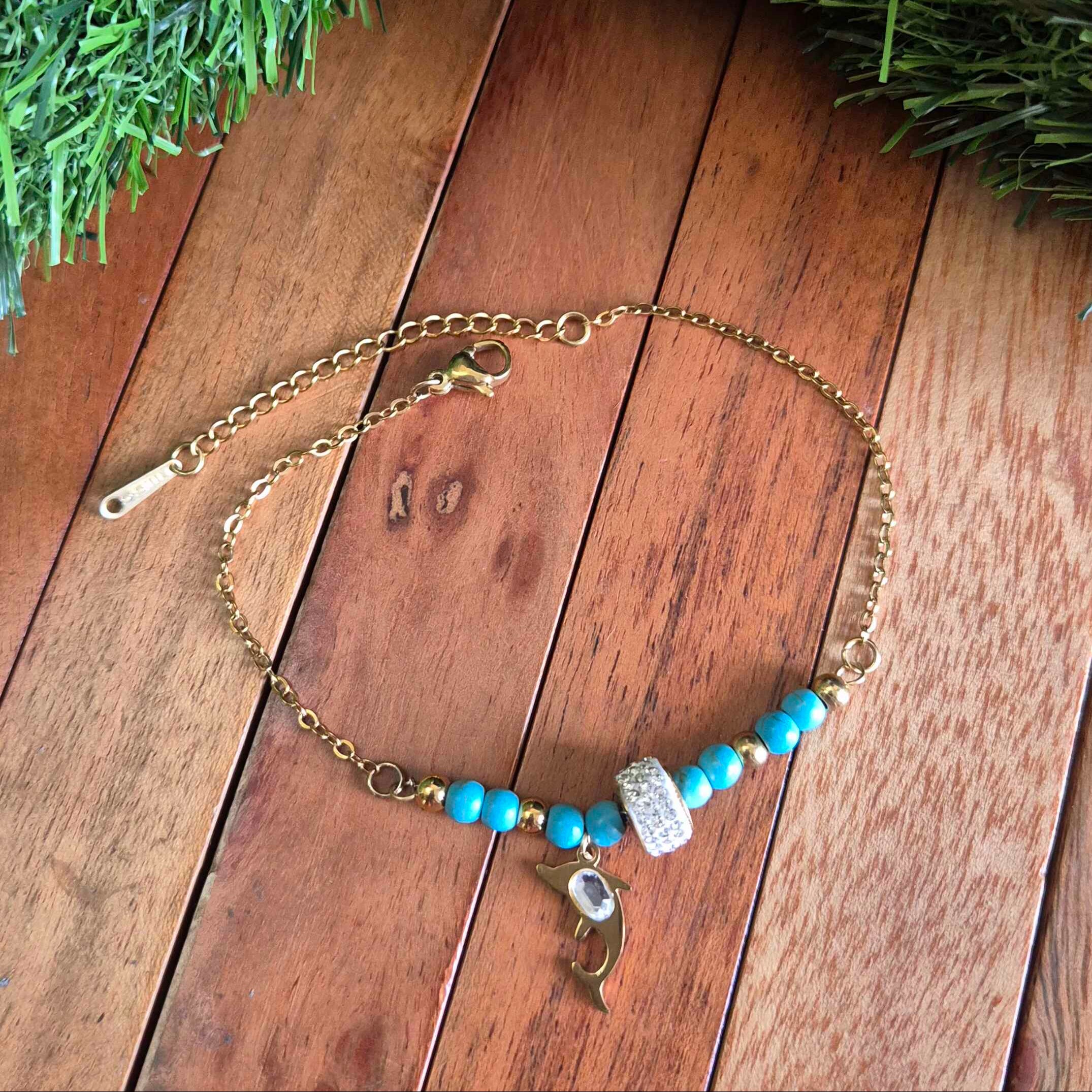 Gold-Tone Dolphin Charm Bracelet with Turquoise Beads