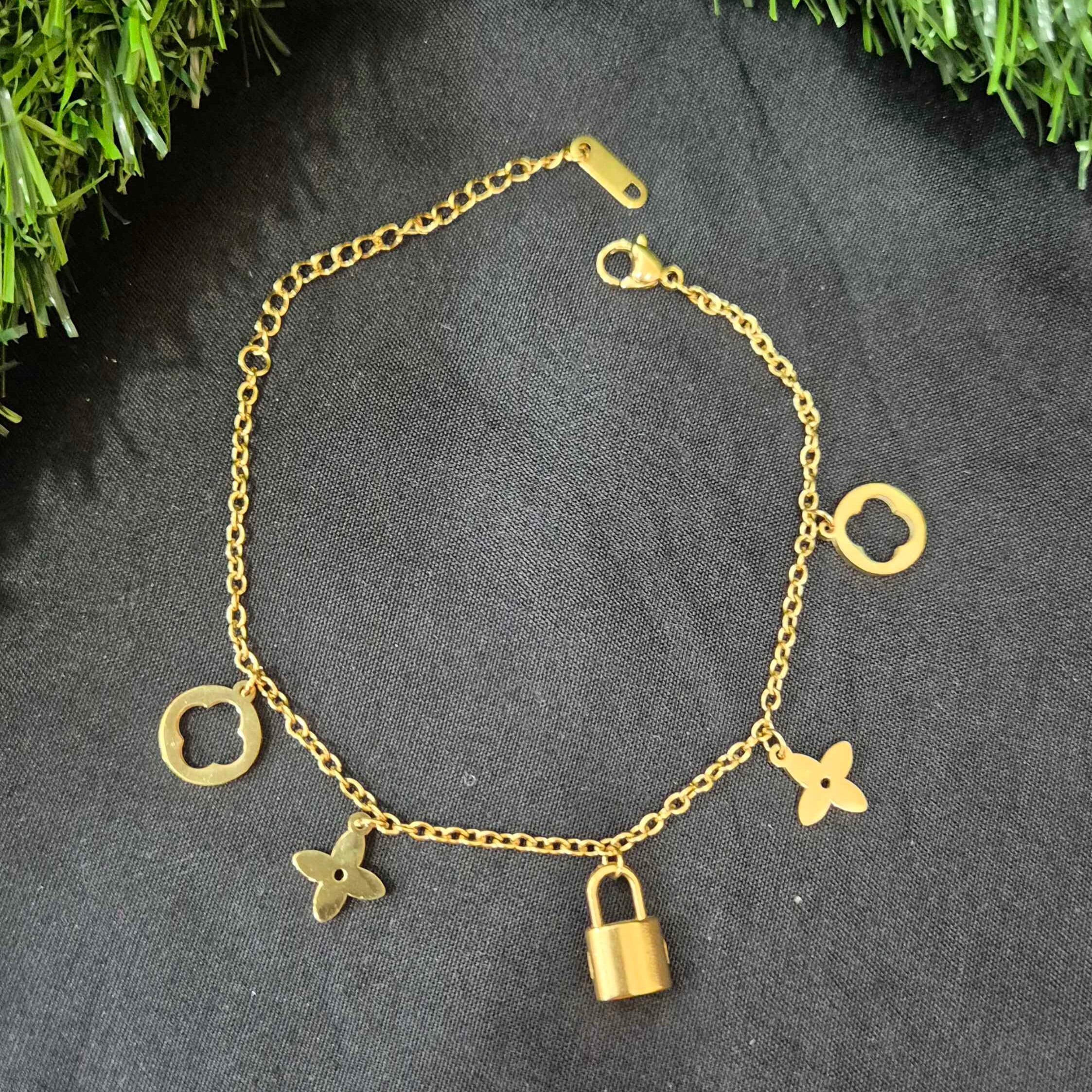 Gold-Tone Charm Bracelet with Lock and Floral Motif Charms