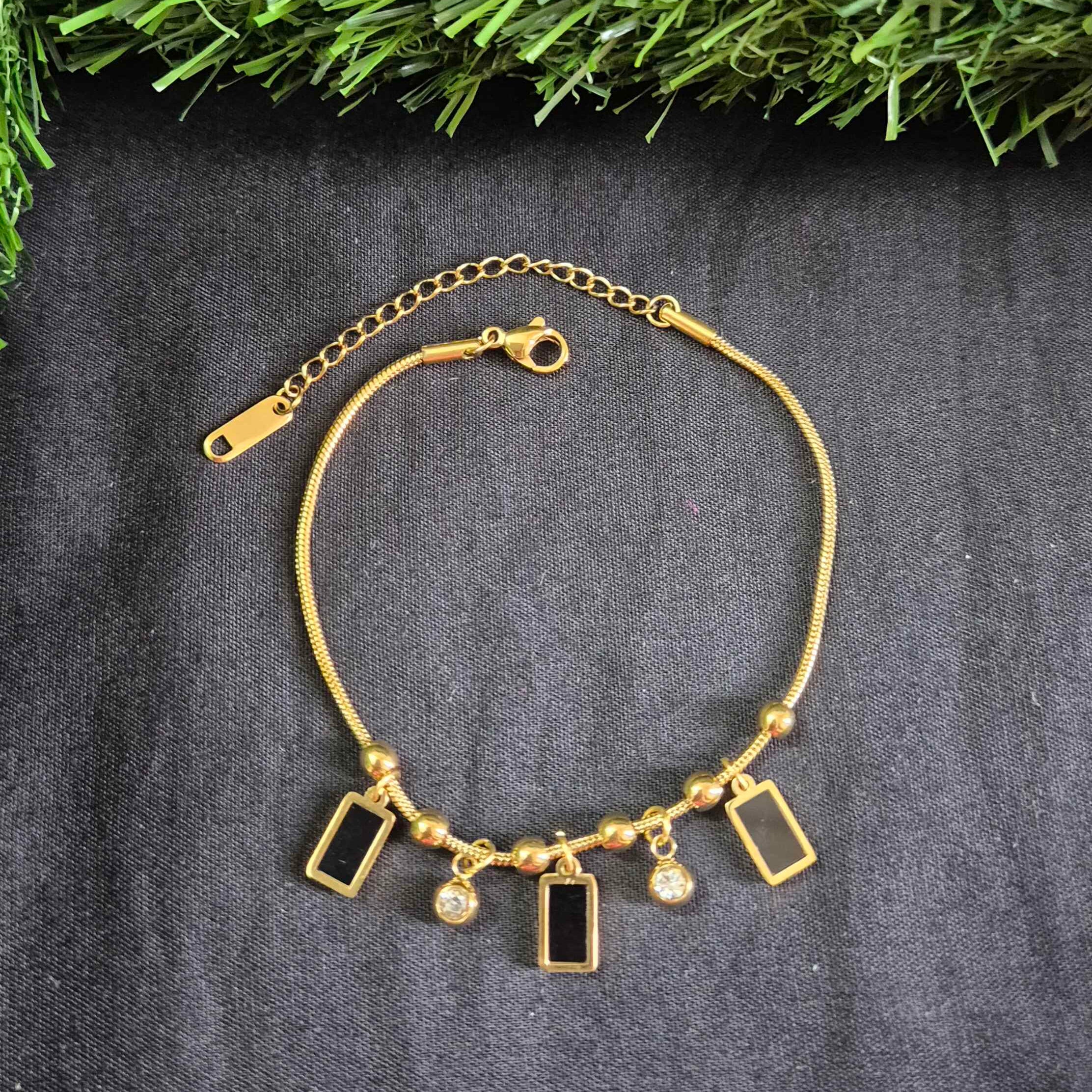 Elegant Gold-Tone Charm Bracelet with Black Enamel & Crystal Accents for Women