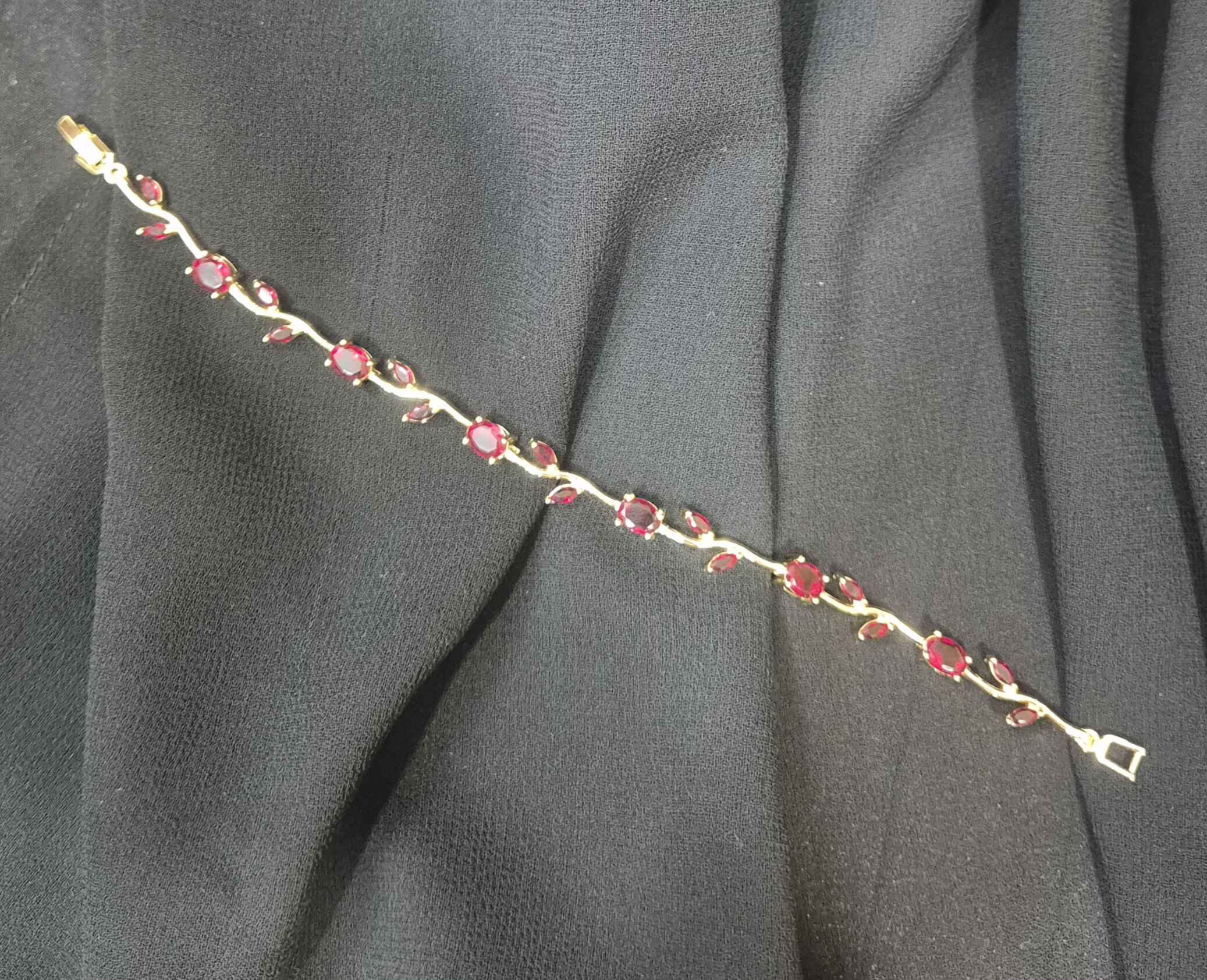 Tulip floral bracelet with maroon stones in gold plated chain