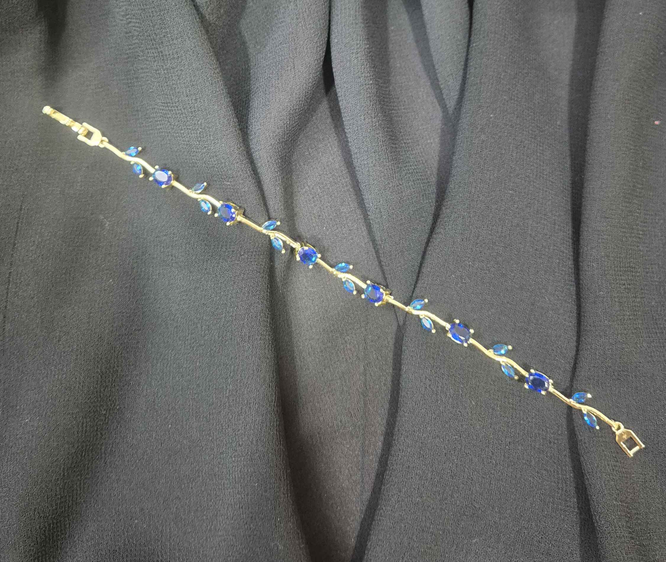 Tulip flower bracelet with royal blue stones in gold finish chain