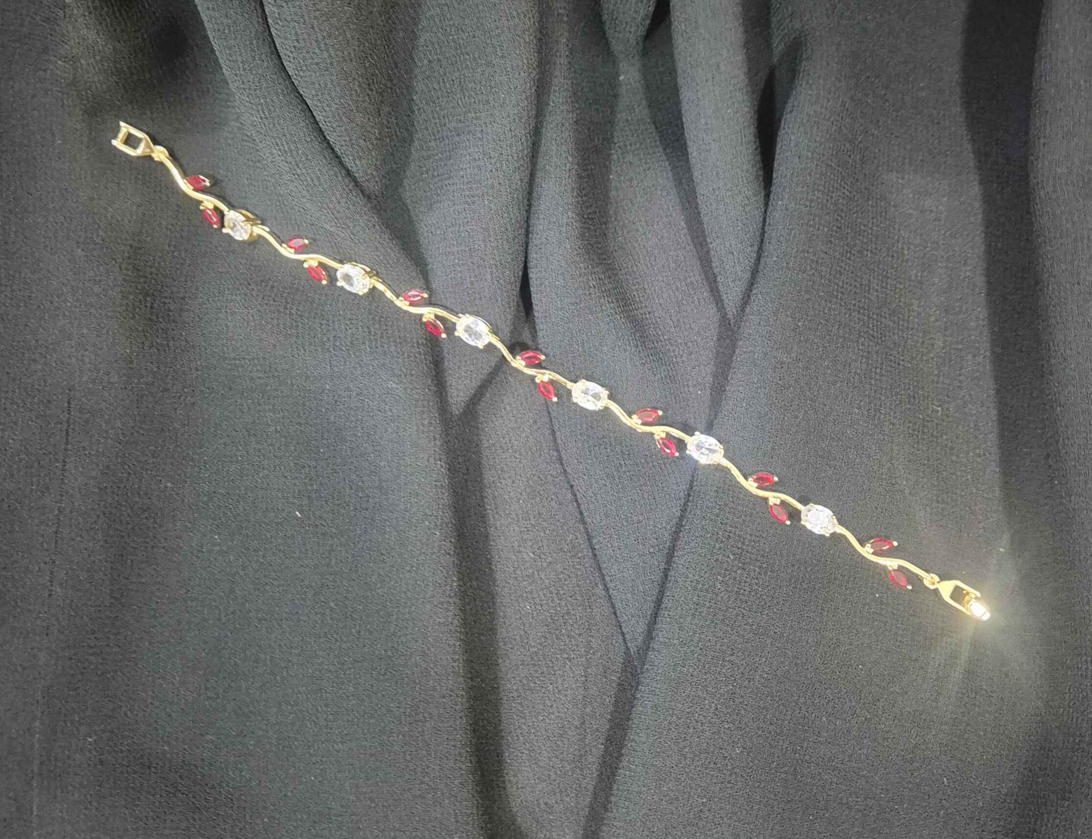 Tulip bracelet with red and white stones.