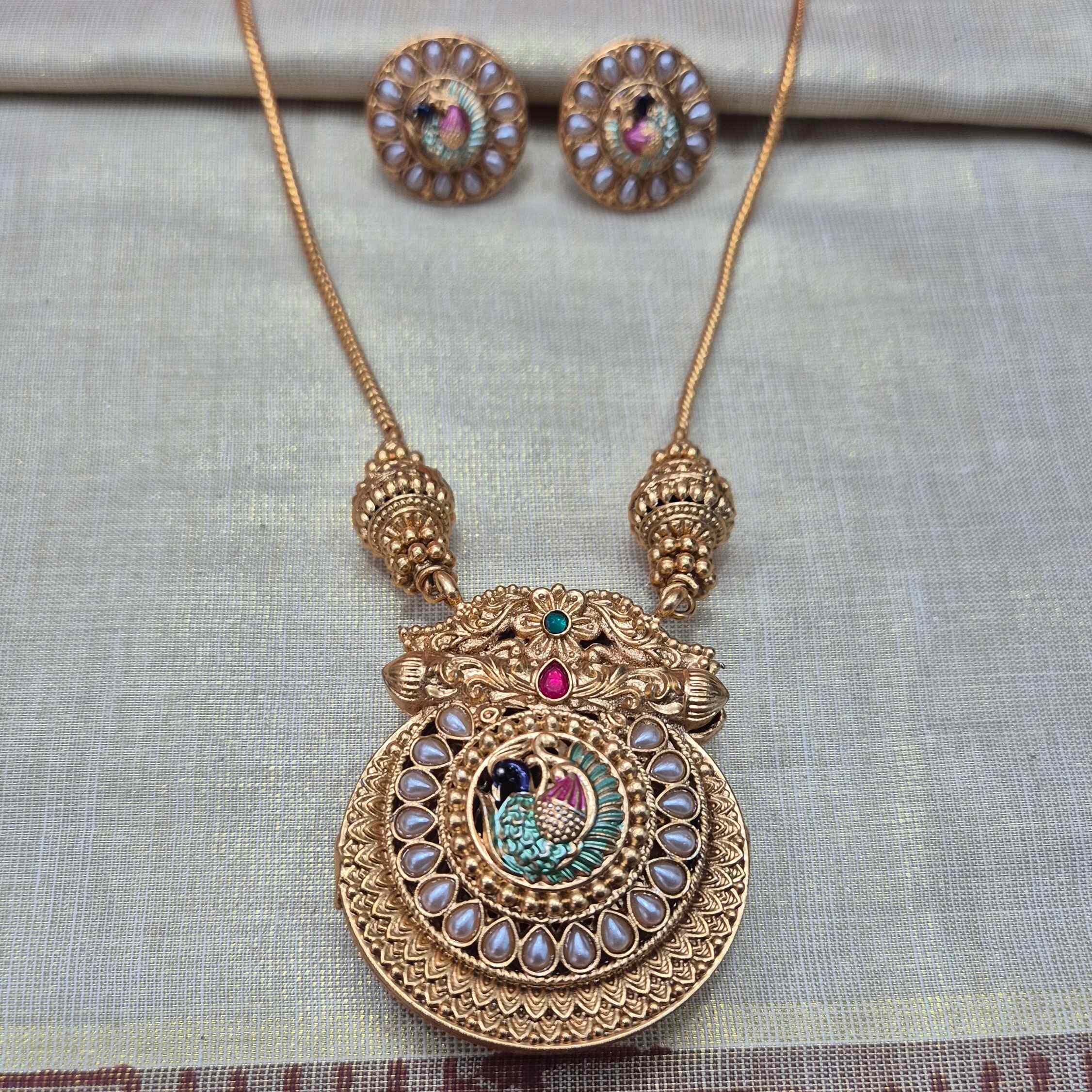 Double sided Kerala Peacock Pendant Necklace Set | Green on one side and white pearl on the otherr