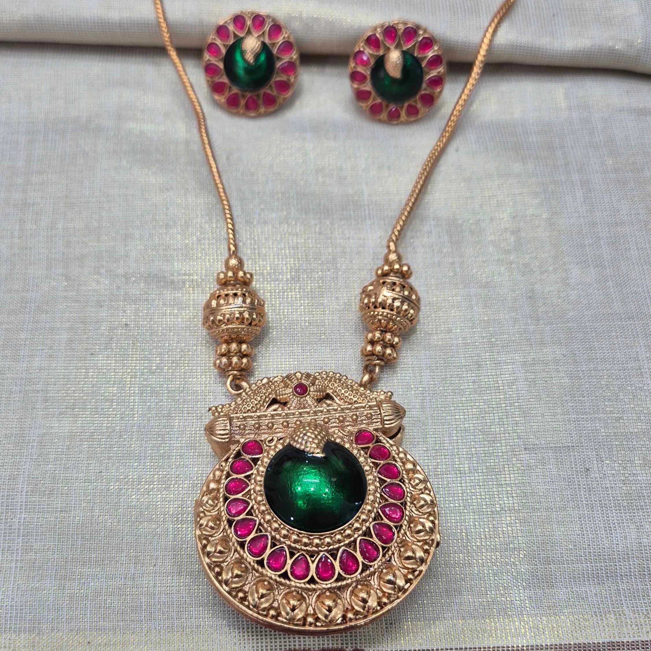Double sided Kerala Peacock Pendant Necklace Set | Green on one side and white pearl on the otherr