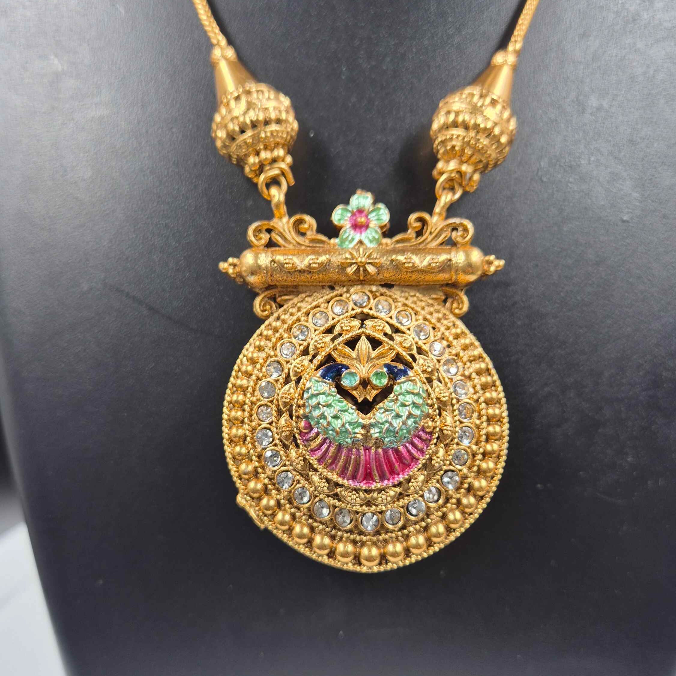 Double sided round pendant-Peacock in pearl design on one side+ Green Pallaka design on another side.