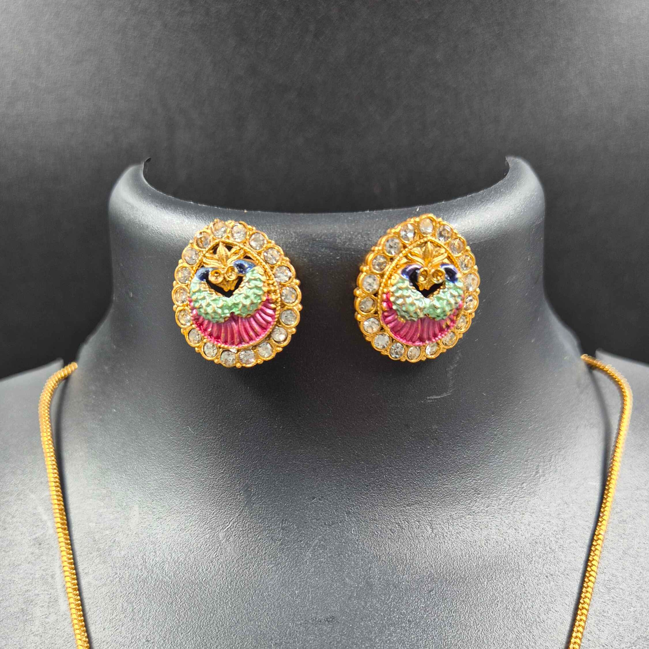 Double sided round pendant-Peacock in pearl design on one side+ Green Pallaka design on another side.