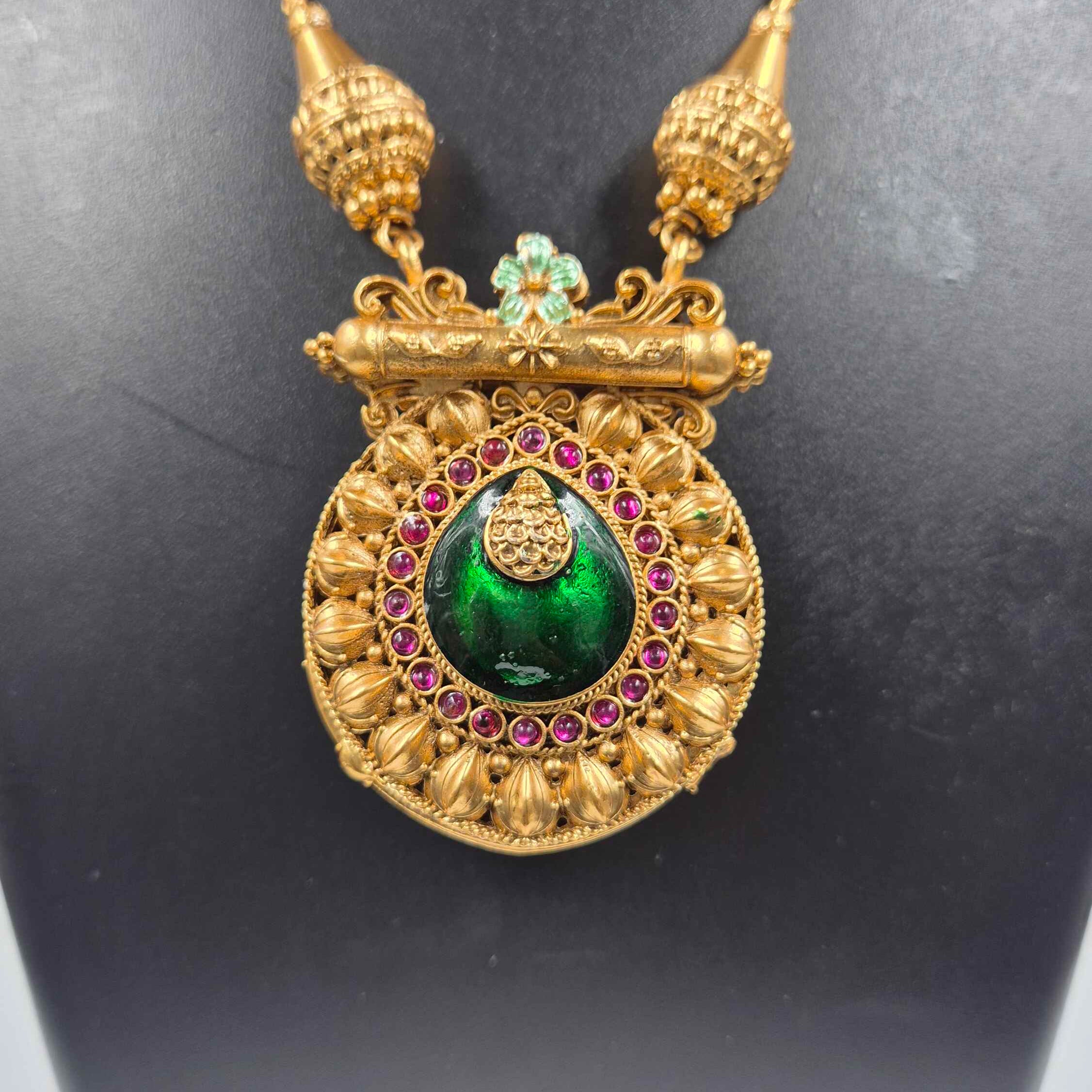 Double sided round pendant-Peacock in pearl design on one side+ Green Pallaka design on another side.