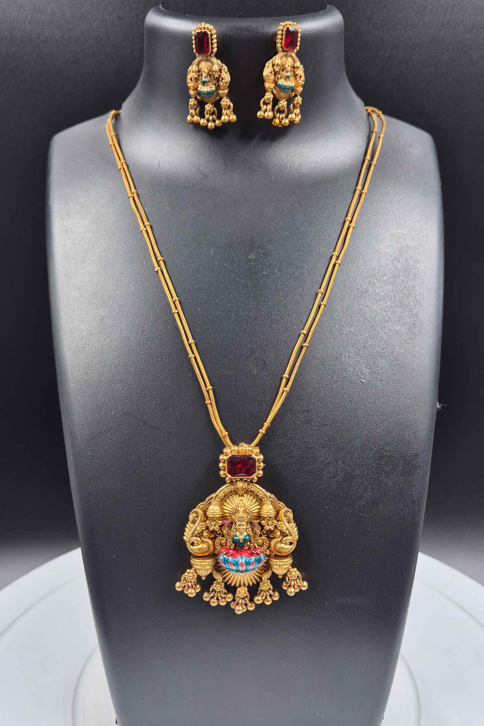 Double stranded Goddess Lakshmi Pendant Necklace Set with Ruby Red Stone and Antique Finish