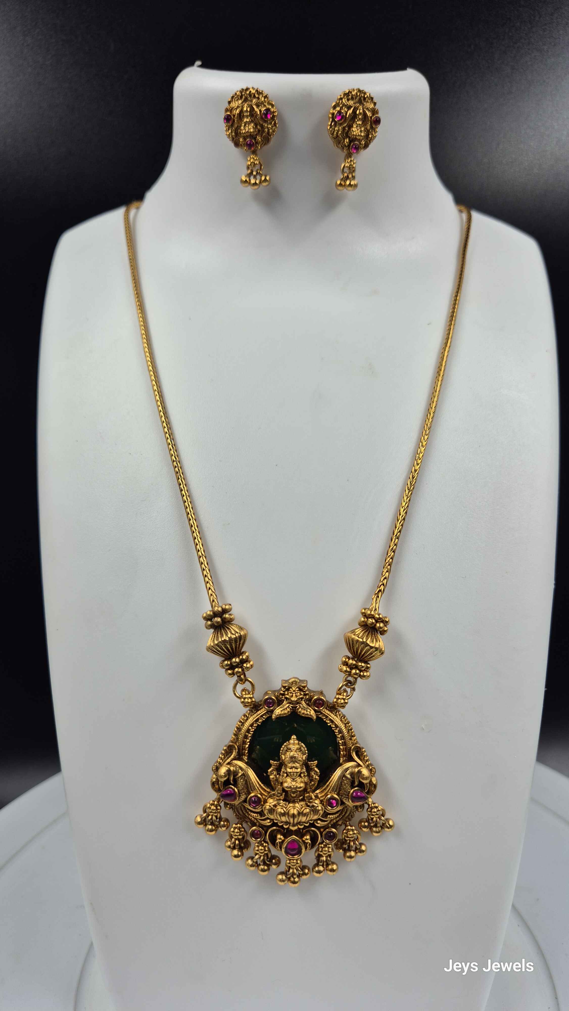 Gold Lakshmi Pendant Necklace Set with Green Stone | Traditional Temple Jewelry with Stud Earrings