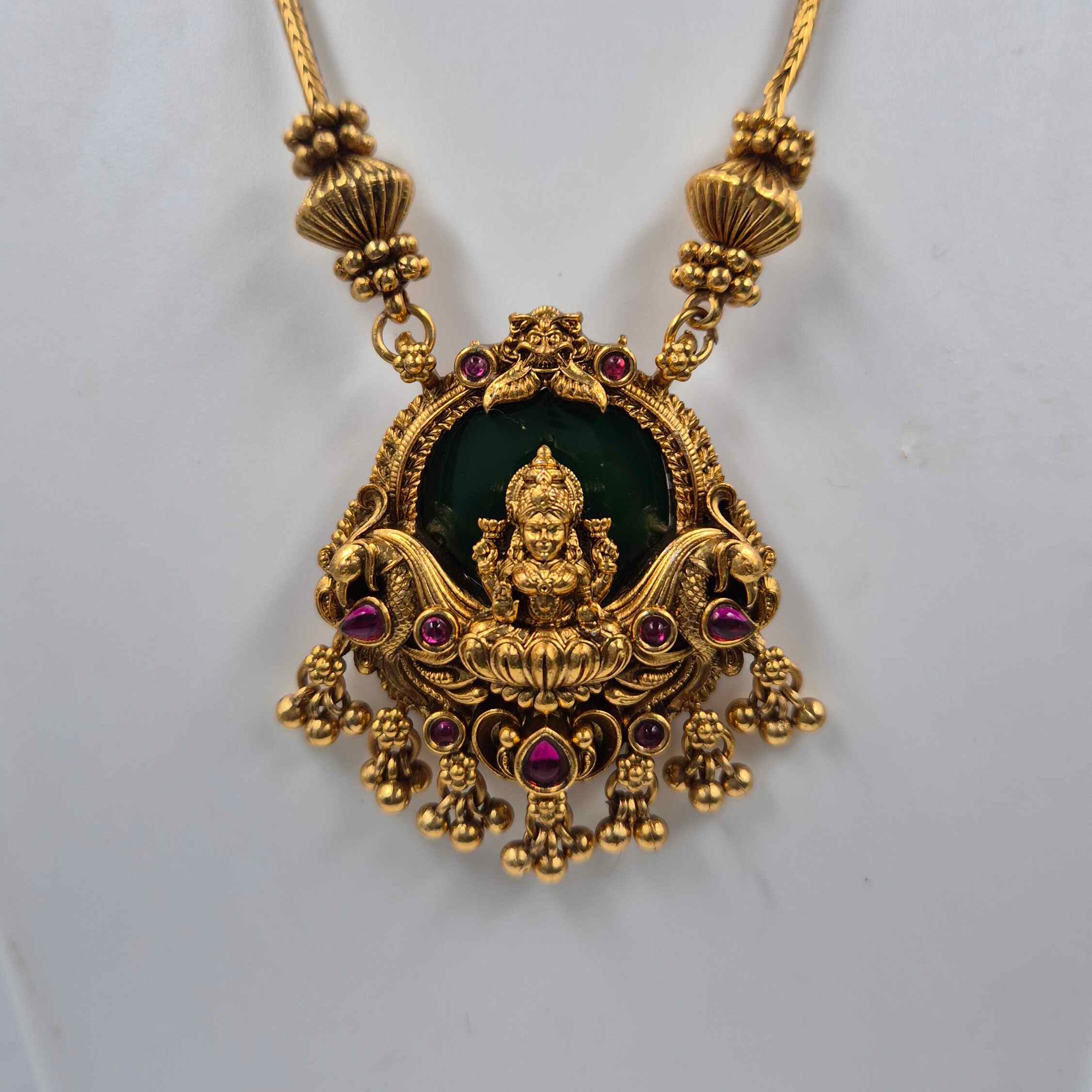 Gold Lakshmi Pendant Necklace Set with Green Stone | Traditional Temple Jewelry with Stud Earrings