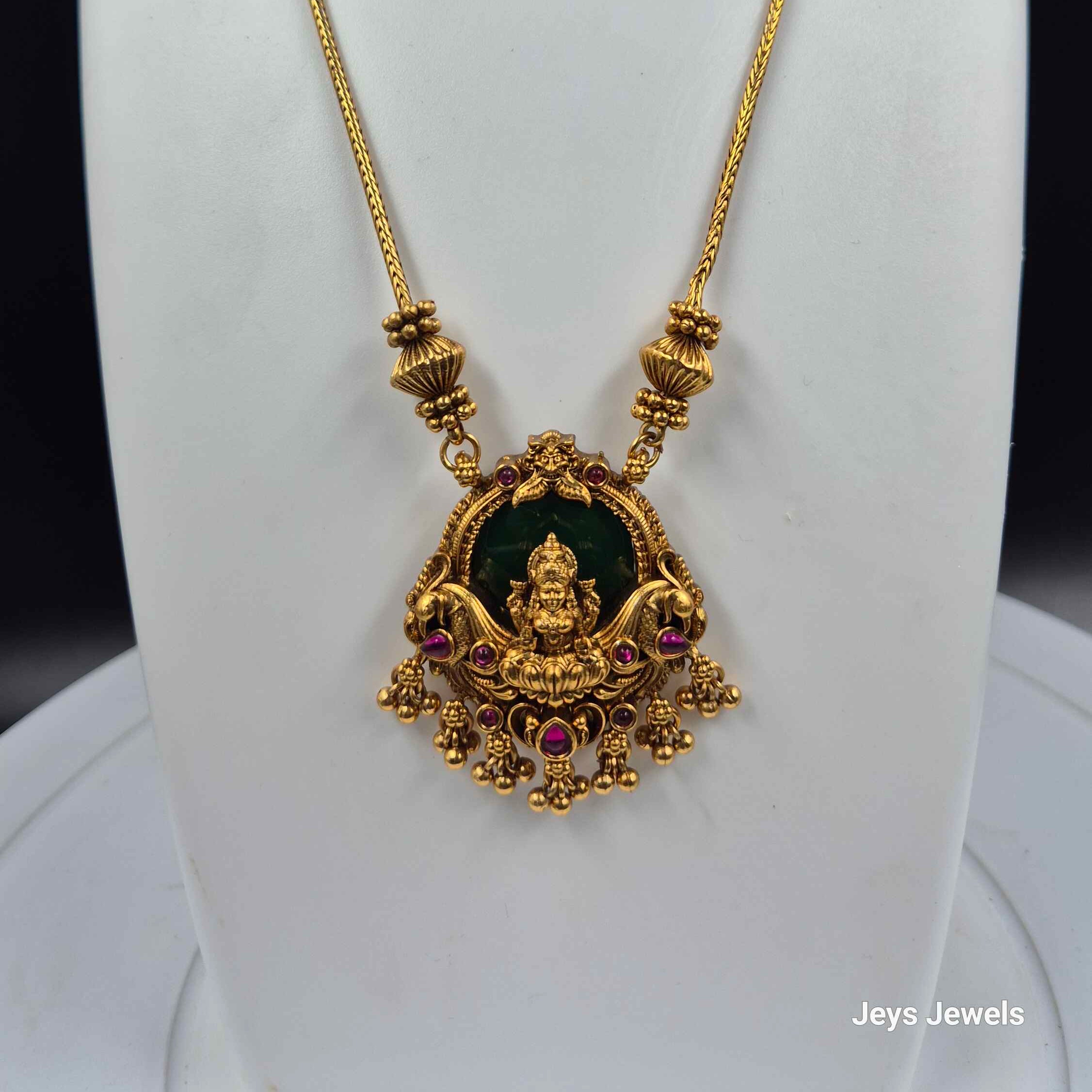 Gold Lakshmi Pendant Necklace Set with Green Stone | Traditional Temple Jewelry with Stud Earrings