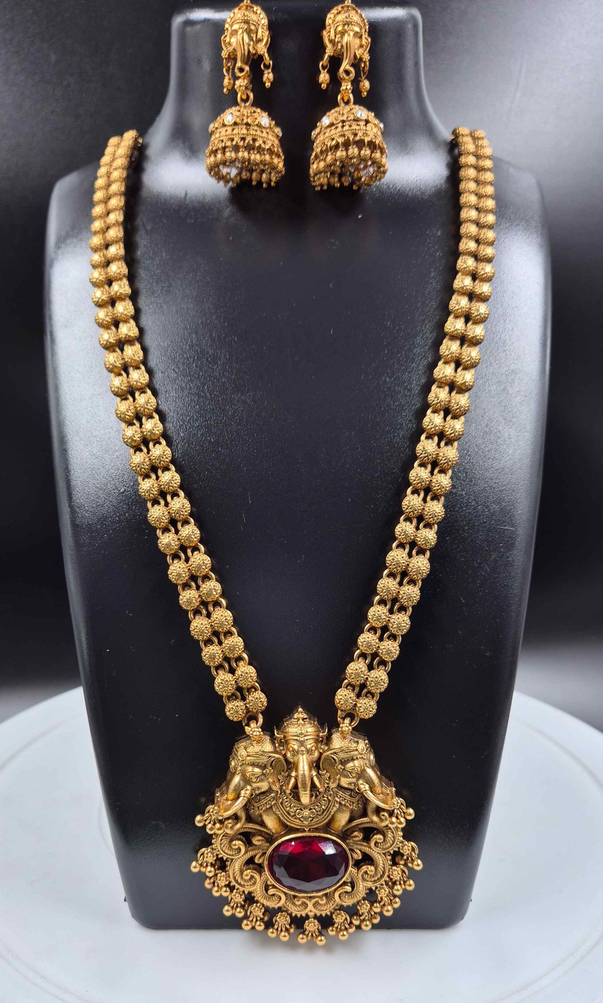 Antique Gold Ganesha Haram Necklace Set with  red stone and Jhumka Earrings
