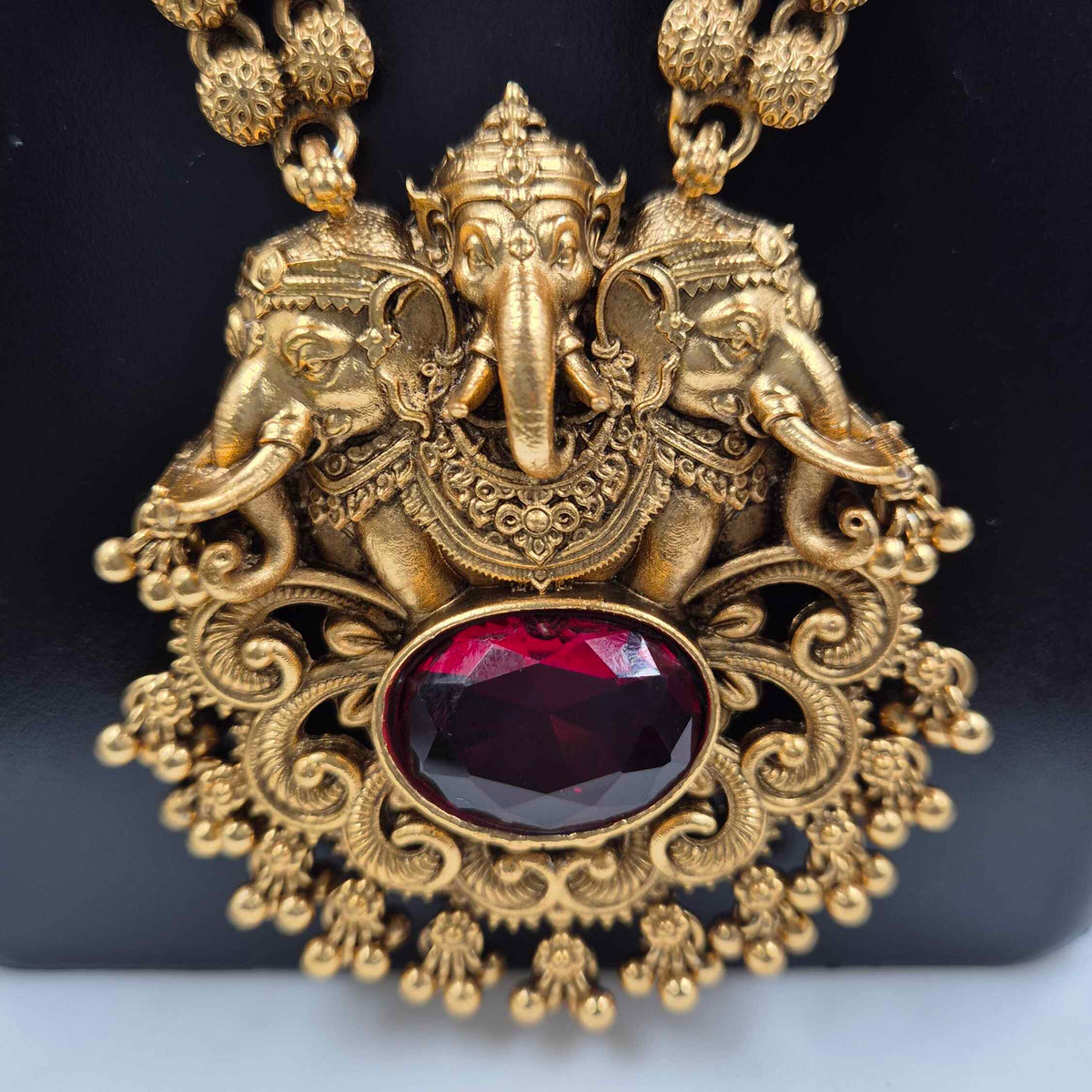 Antique Gold Ganesha Haram Necklace Set with  red stone and Jhumka Earrings