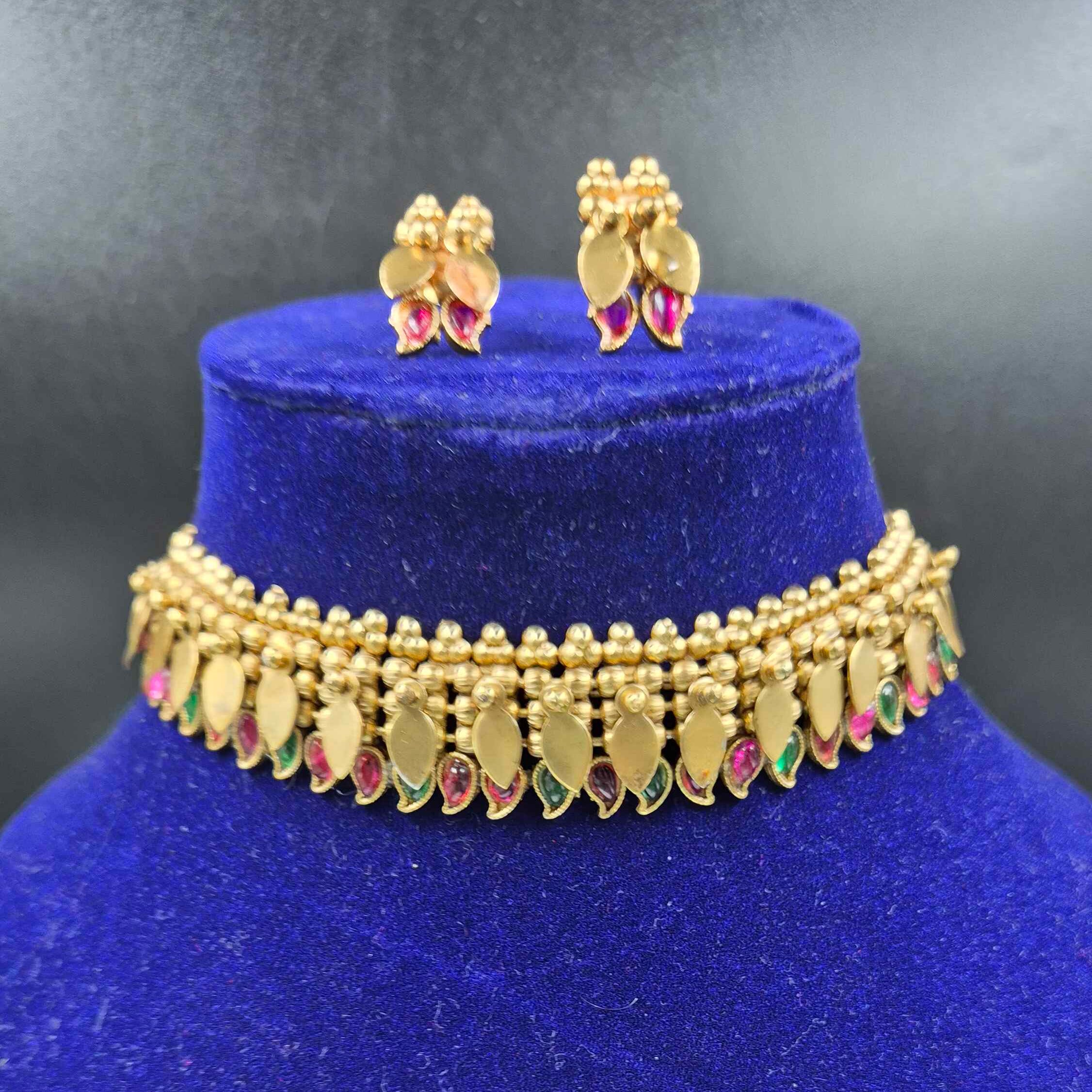 Kerala style elakkathali with green a nd red stoned mango design
