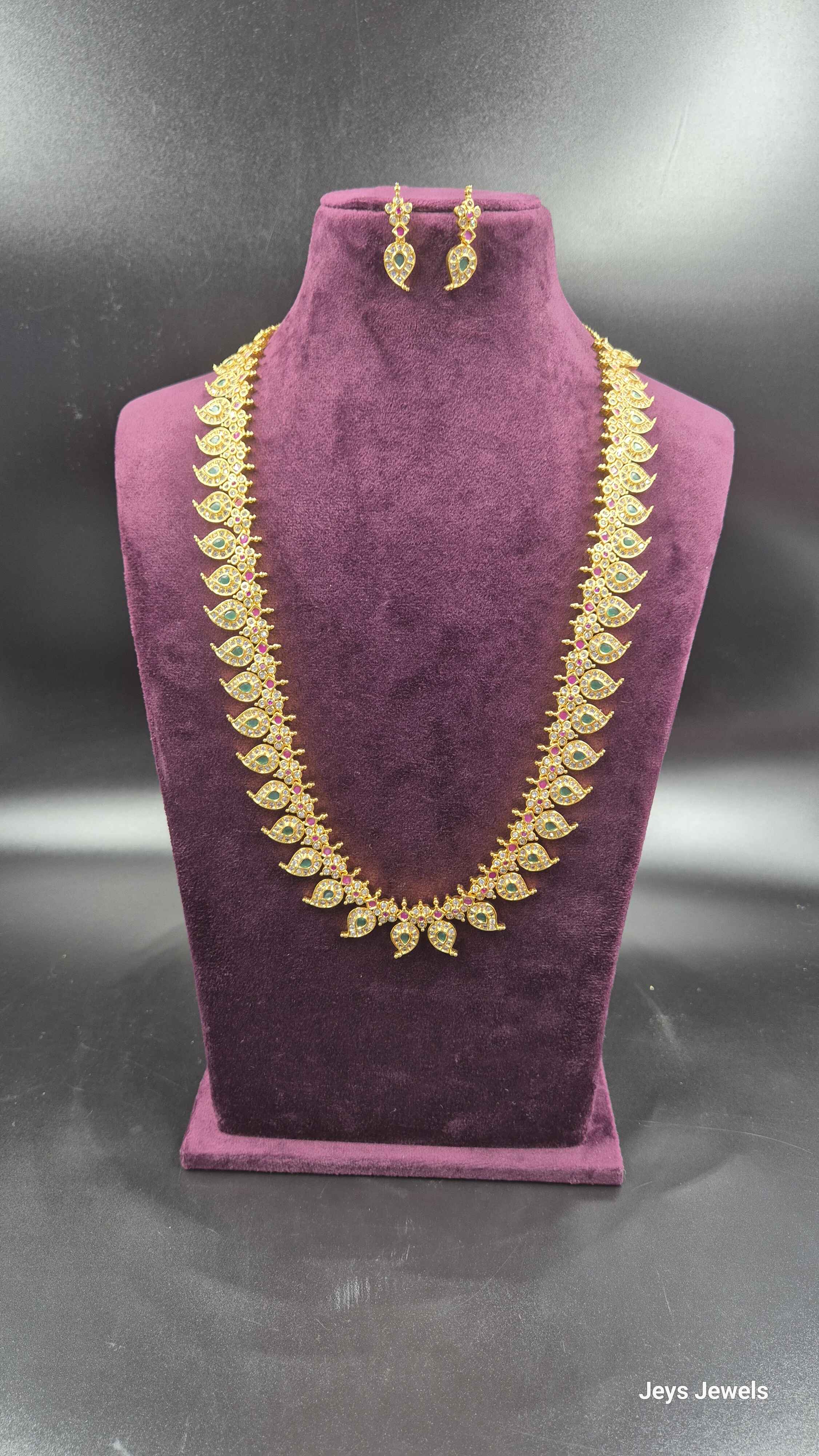 Leaf Design Long Haram  with green,red and white AD stones  with Earrings | Designer Bridal Jeweller