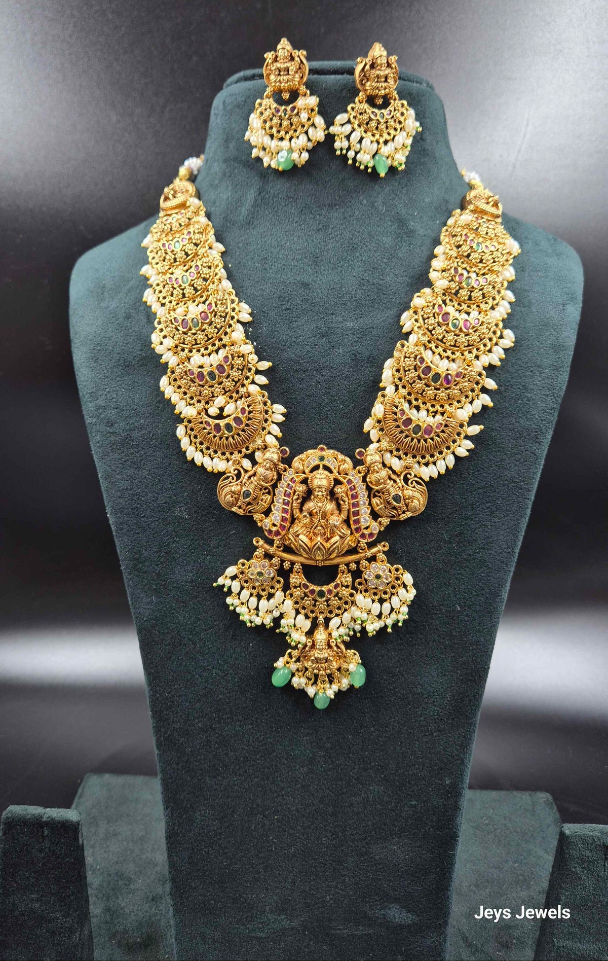 3 D embossed Lakshmi on lotus pendant in Jadau Kundan  with Green Beads & Pearls | Bridal Jewellery