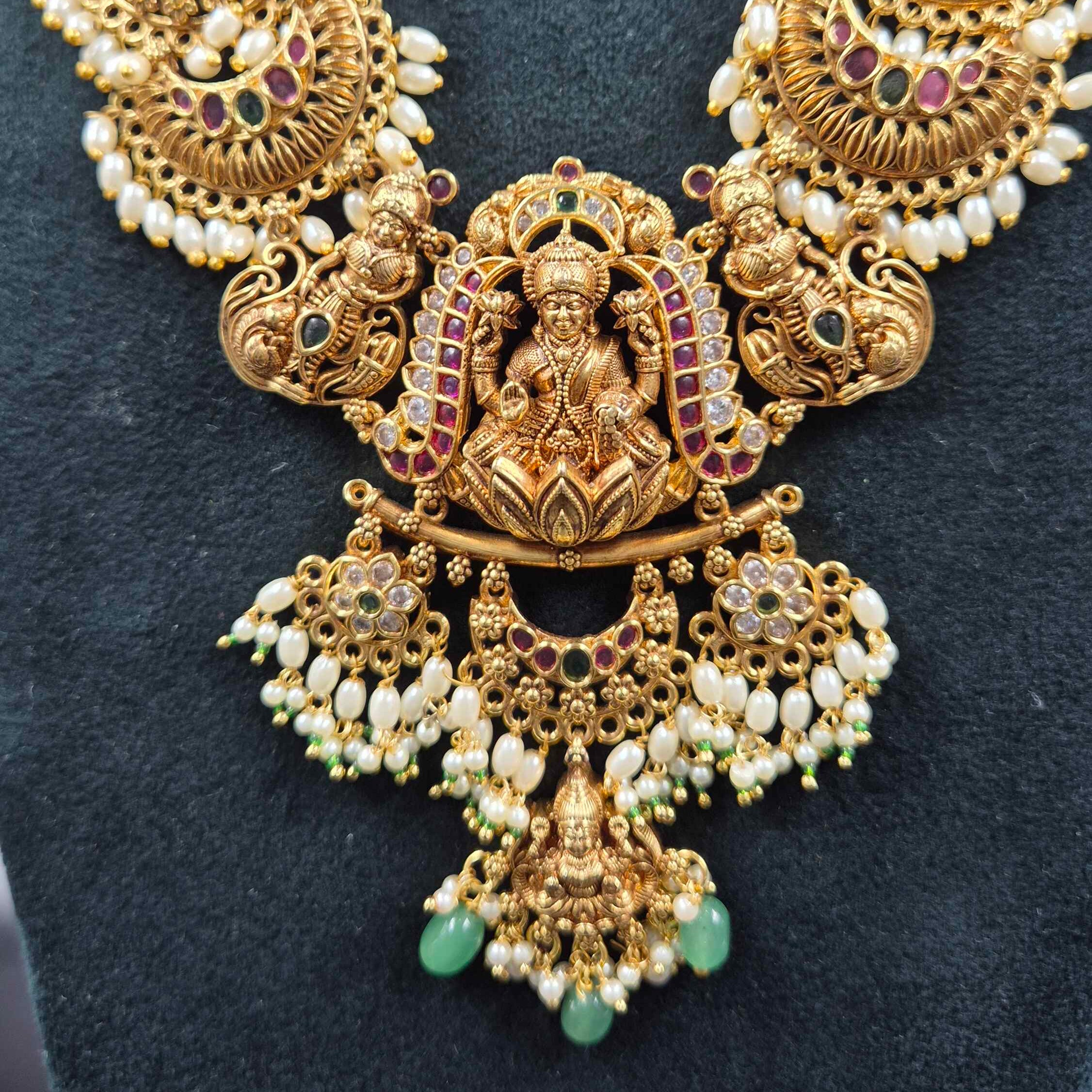 3 D embossed Lakshmi on lotus pendant in Jadau Kundan  with Green Beads & Pearls | Bridal Jewellery