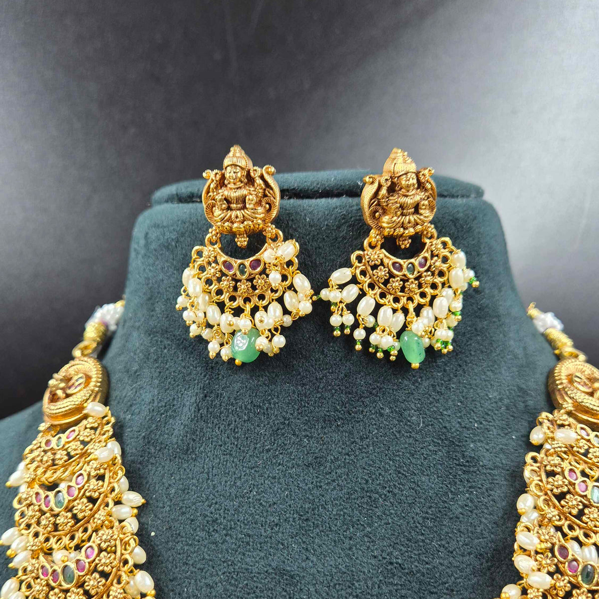3 D embossed Lakshmi on lotus pendant in Jadau Kundan  with Green Beads & Pearls | Bridal Jewellery