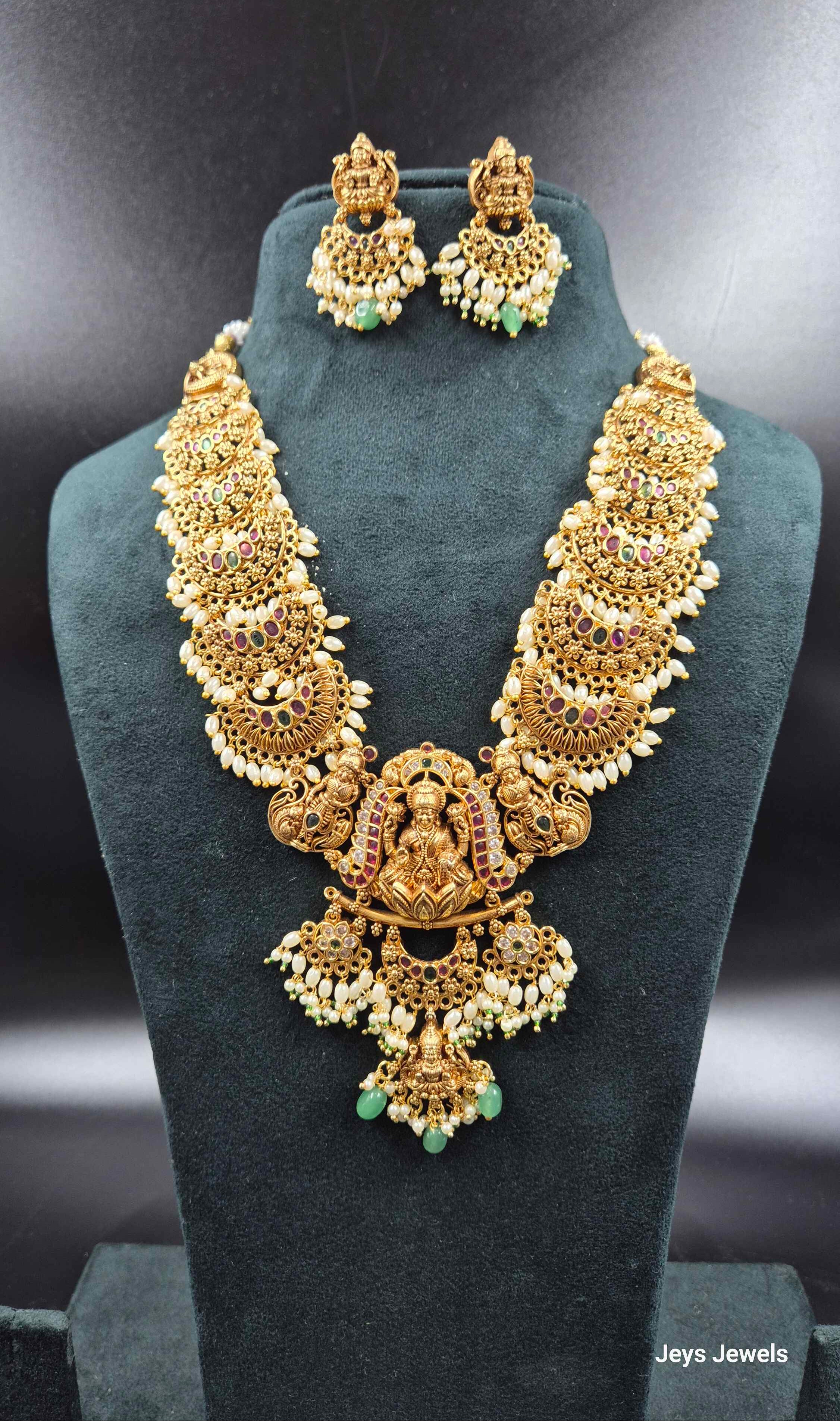 3 D embossed Lakshmi on lotus pendant in Jadau Kundan  with Green Beads & Pearls | Bridal Jewellery