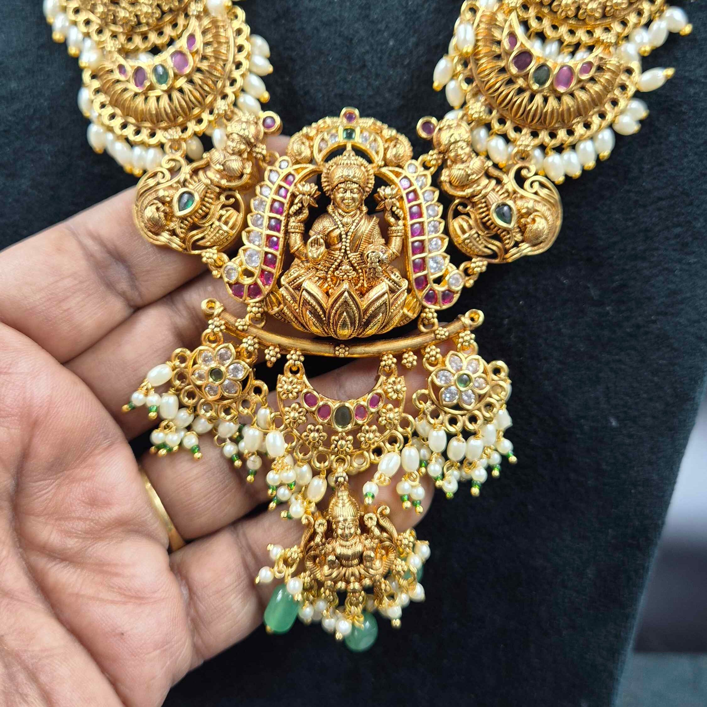 3 D embossed Lakshmi on lotus pendant in Jadau Kundan  with Green Beads & Pearls | Bridal Jewellery
