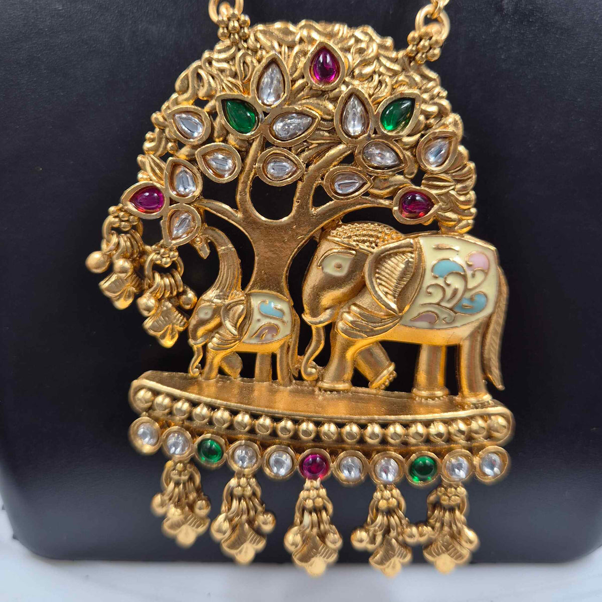 Baby and mother elephants under tree pendant in long chain