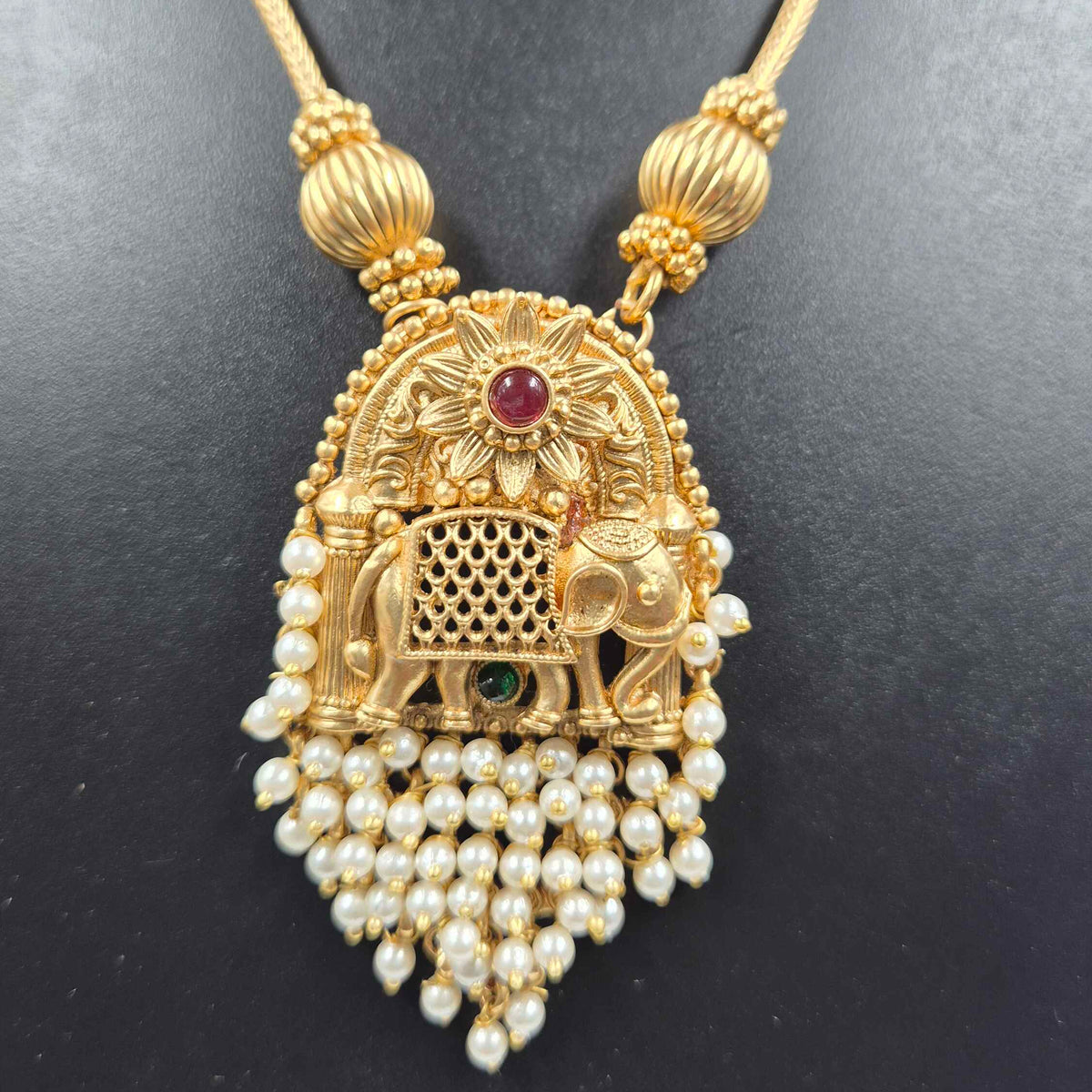 Elephant pendant with cascading pearl hangings