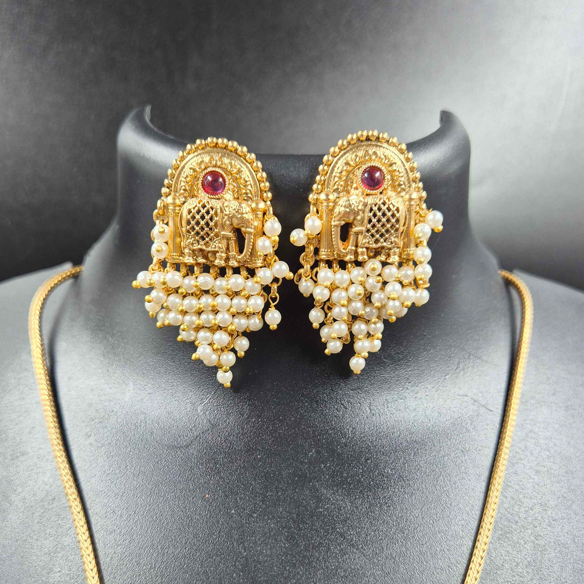 Elephant pendant with cascading pearl hangings
