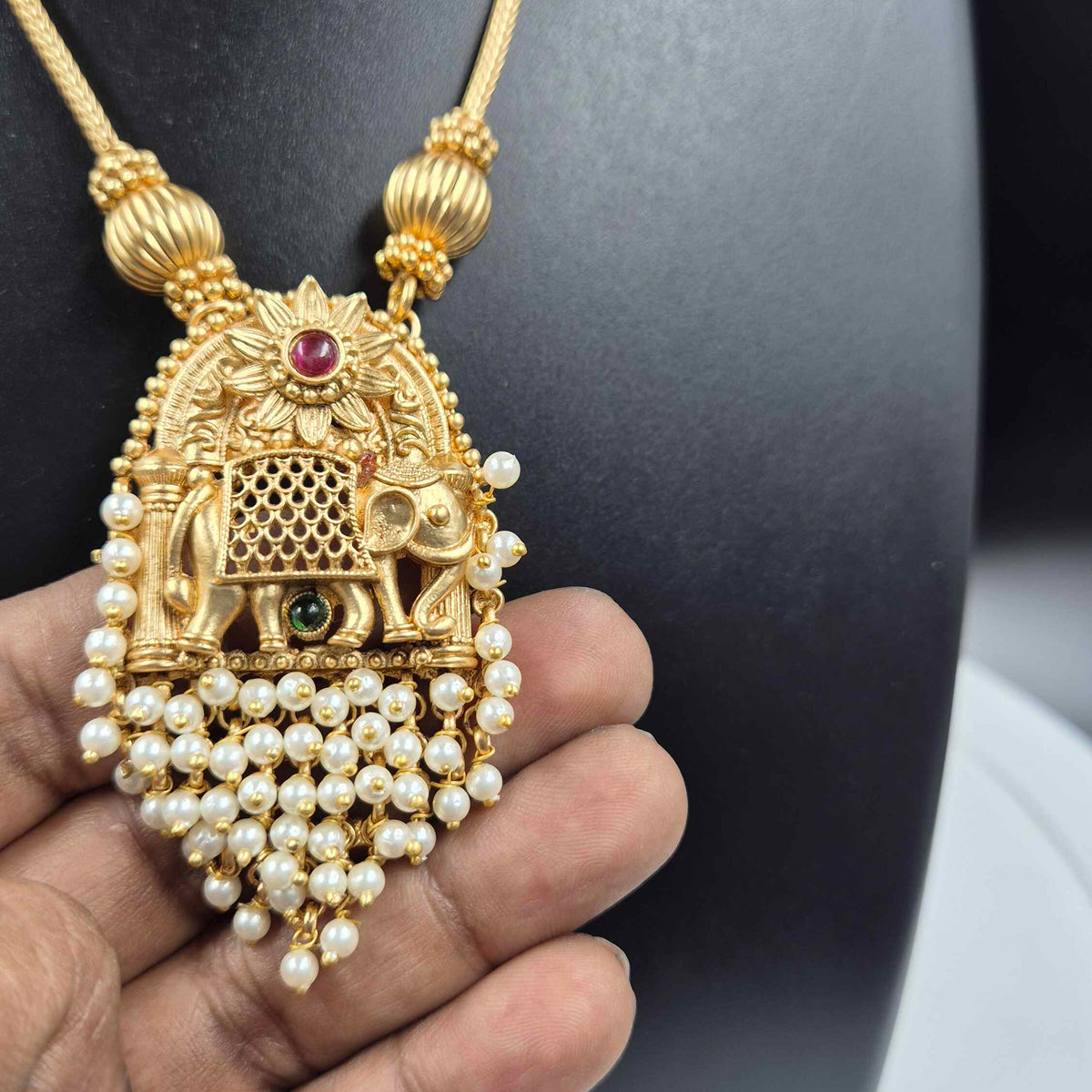 Elephant pendant with cascading pearl hangings