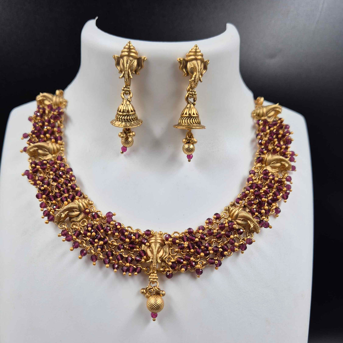 Ganesha face necklace with purple beads and earrings
