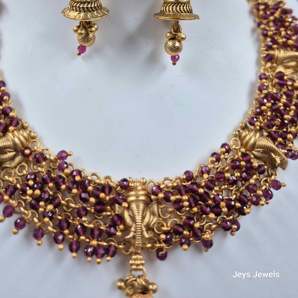 Ganesha face necklace with purple beads and earrings