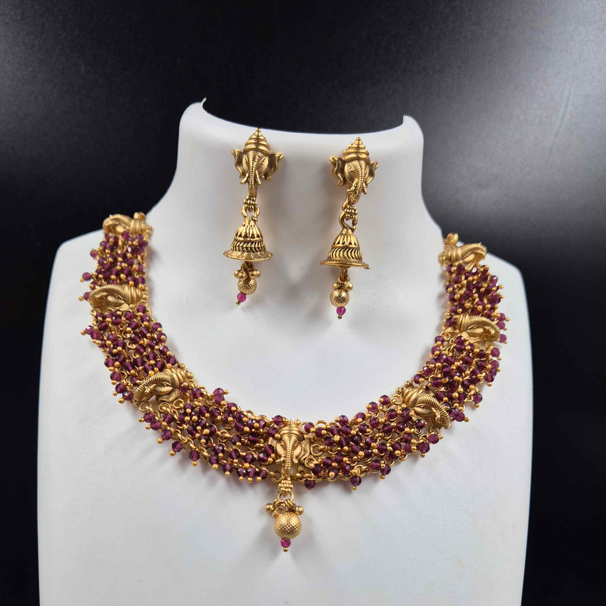 Ganesha face necklace with purple beads and earrings