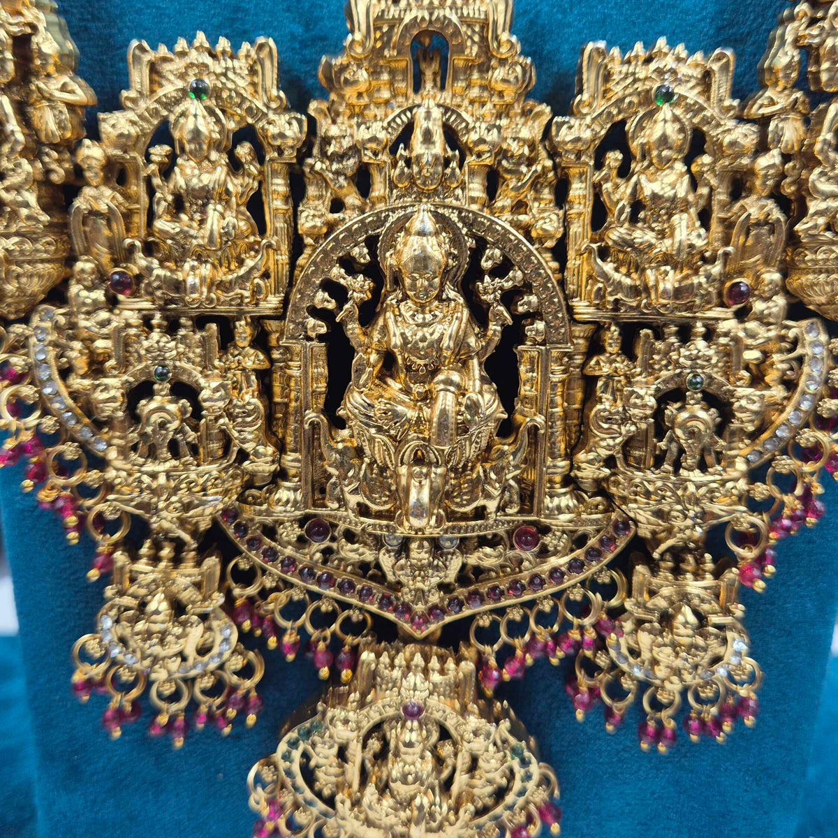 Grand Temple Jewellery Haram with Deity Motifs, red Stones & Earrings
