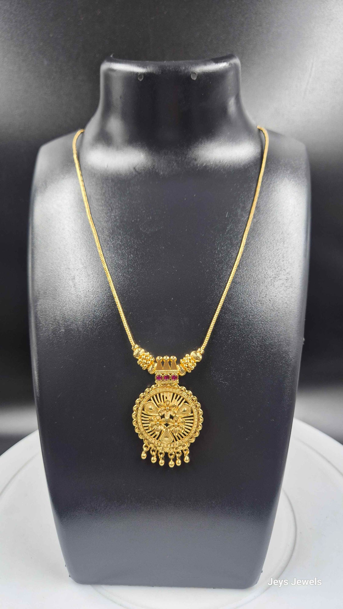 Gold Finish Floral Round Pendant Necklace with Ruby Stone