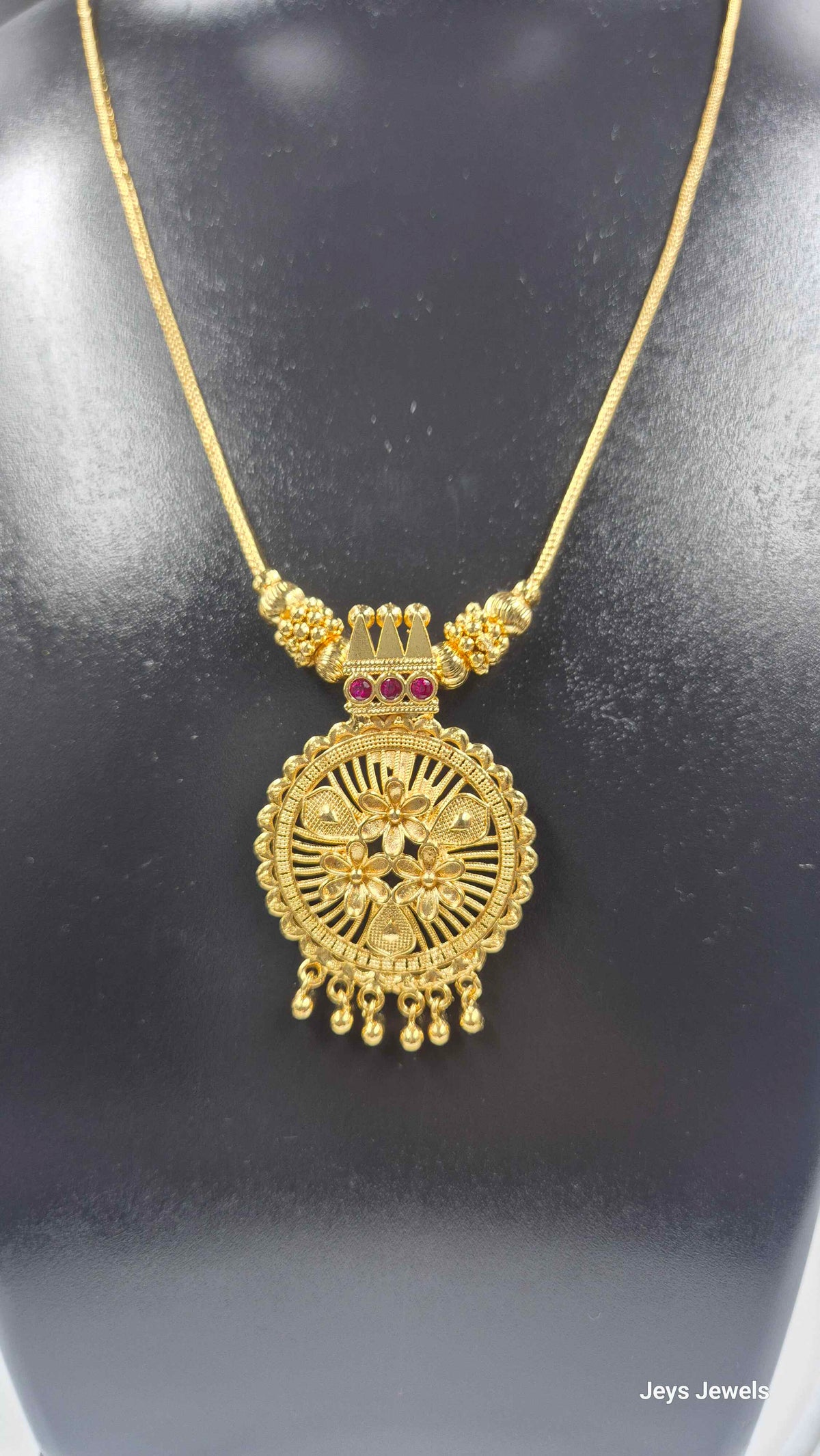 Gold Finish Floral Round Pendant Necklace with Ruby Stone