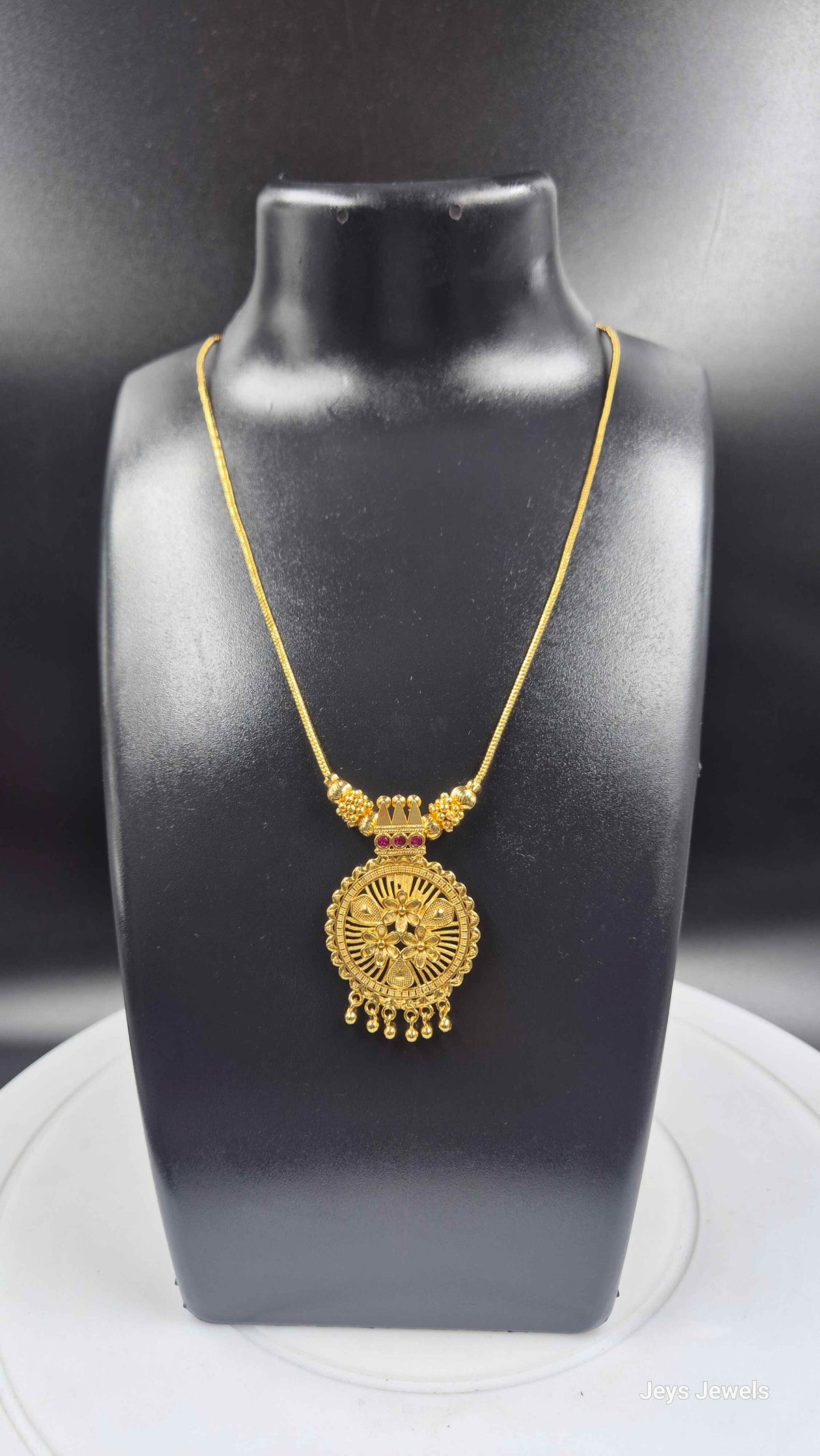 Gold Finish Floral Round Pendant Necklace with Ruby Stone