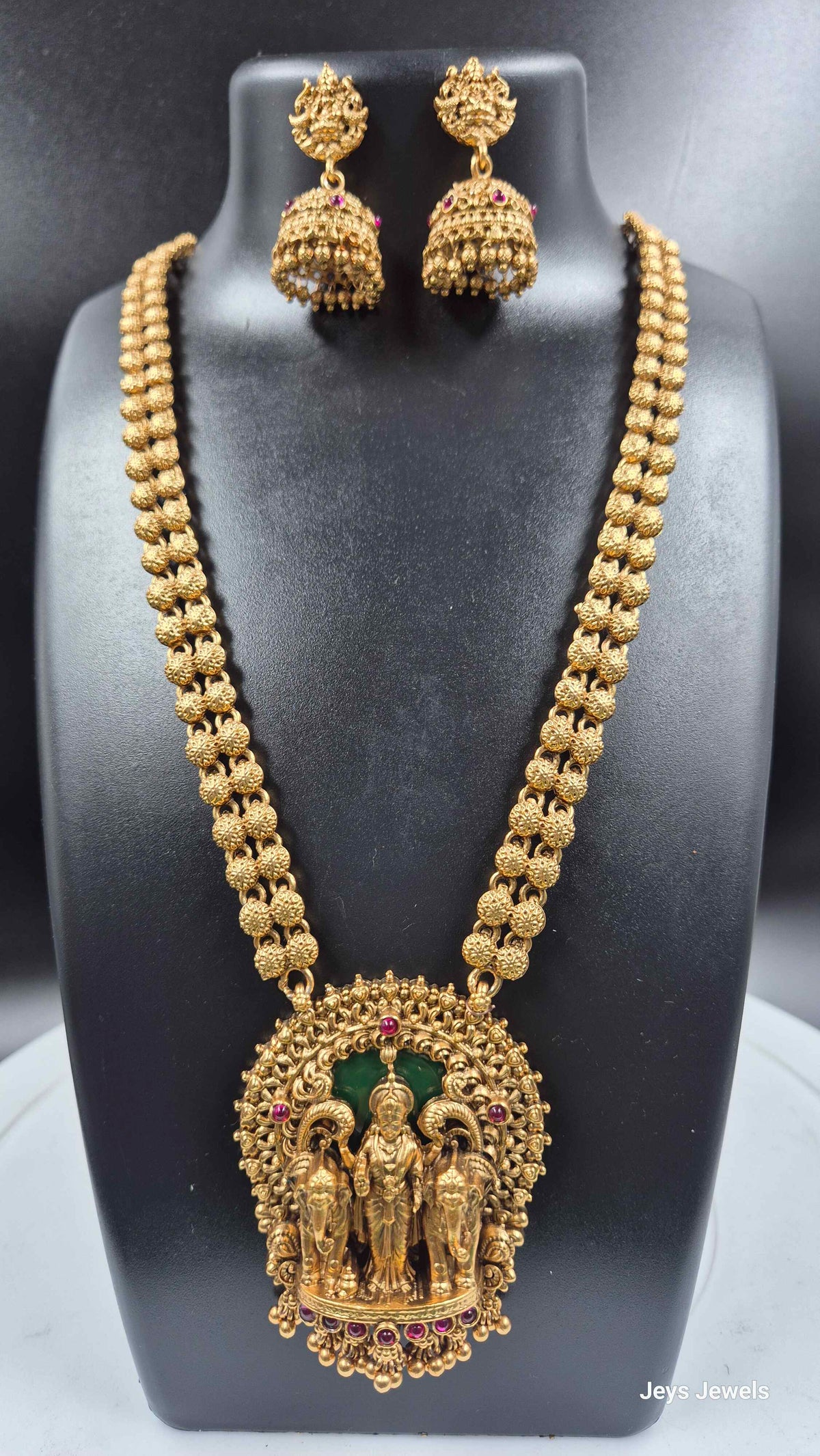 Gajalakshmi haram Set with Green Stones and Jhumkas